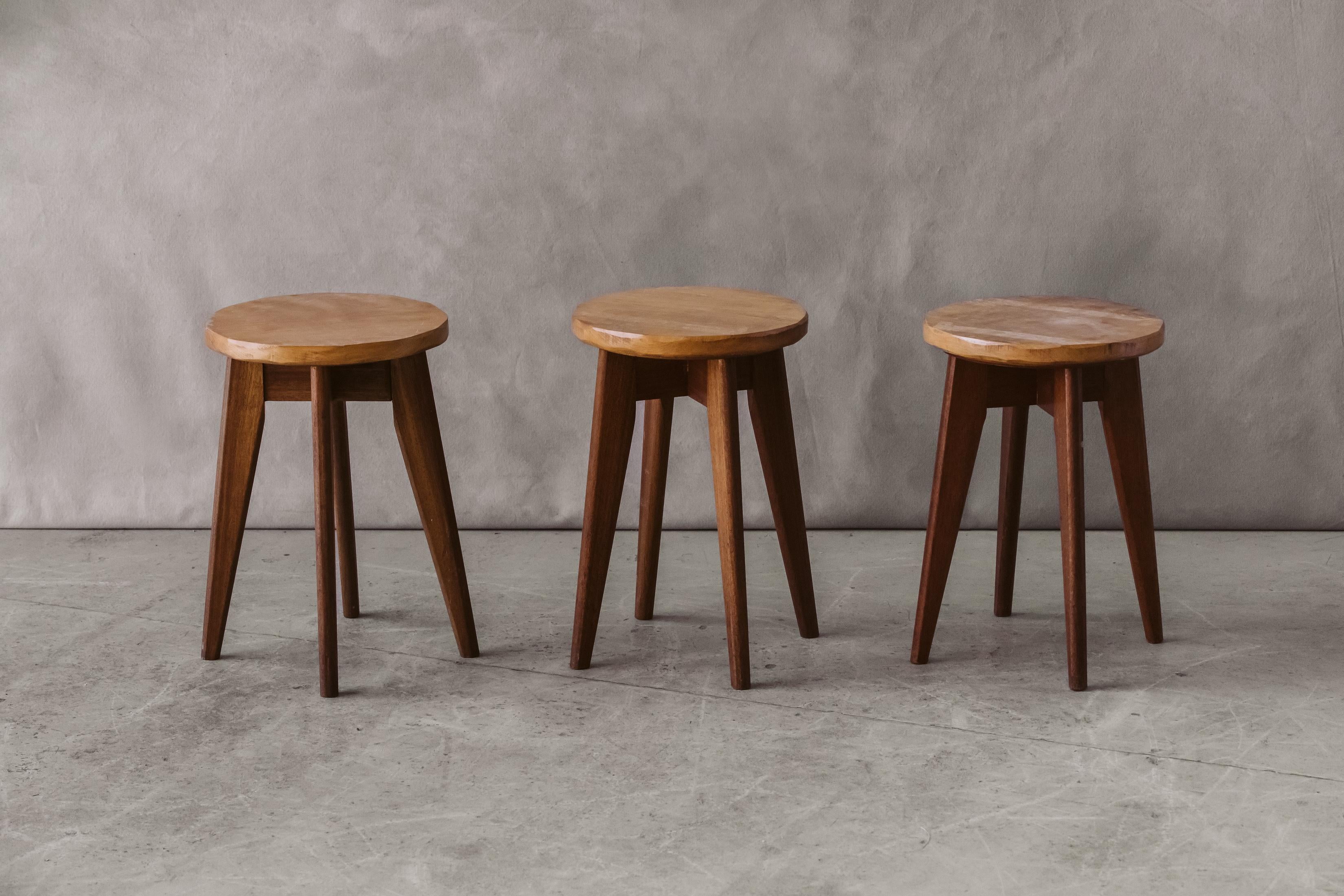 Vintage set of three stools from France, circa 1960. Solid oak design with light wear and use.

We don't have the time to write an extensive description on each of our pieces. We prefer to speak directly with our clients.  So, If you have any
