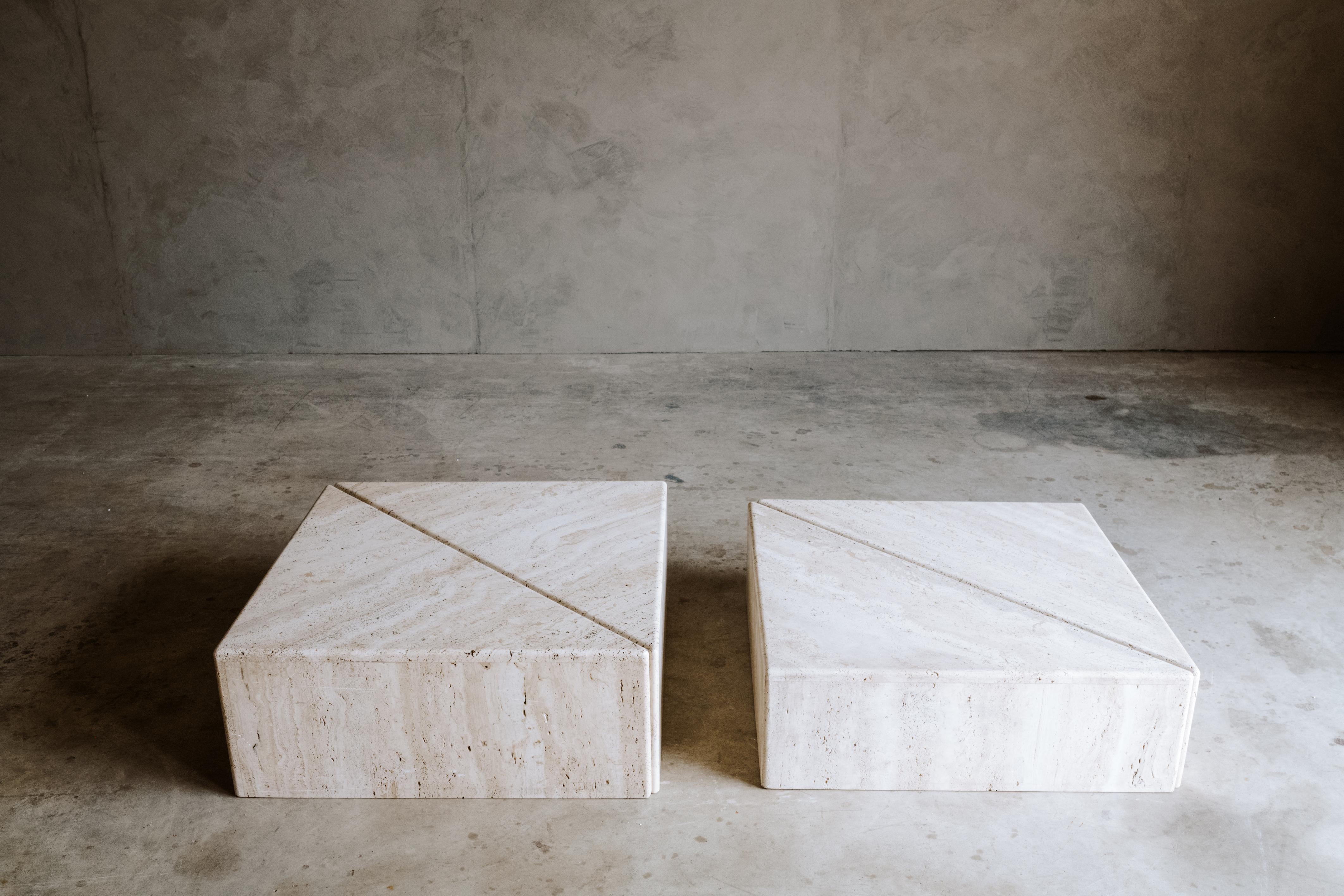 Vintage set of travertine coffee tables From France, Circa 1960. Set of four triangular tables in two heights. Enabling several display options for use. Solid travertine construction and in great condition. Measures: Heights are 11