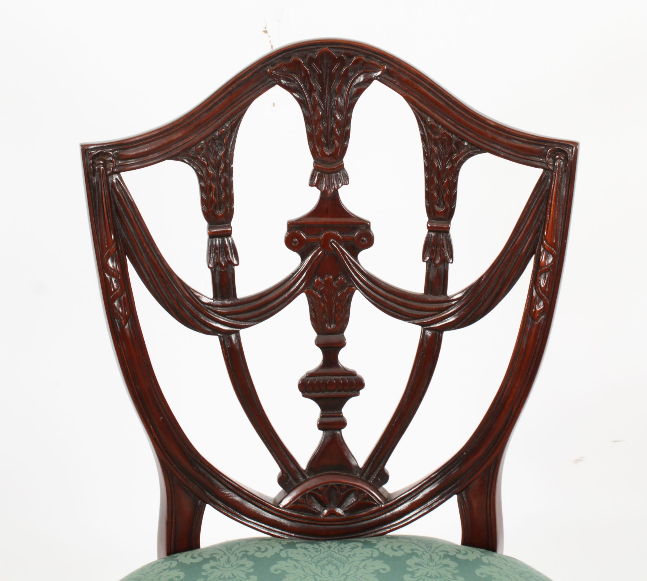 20th Century Vintage Set of Twelve Federal Revival shield back dining chair 20th C For Sale