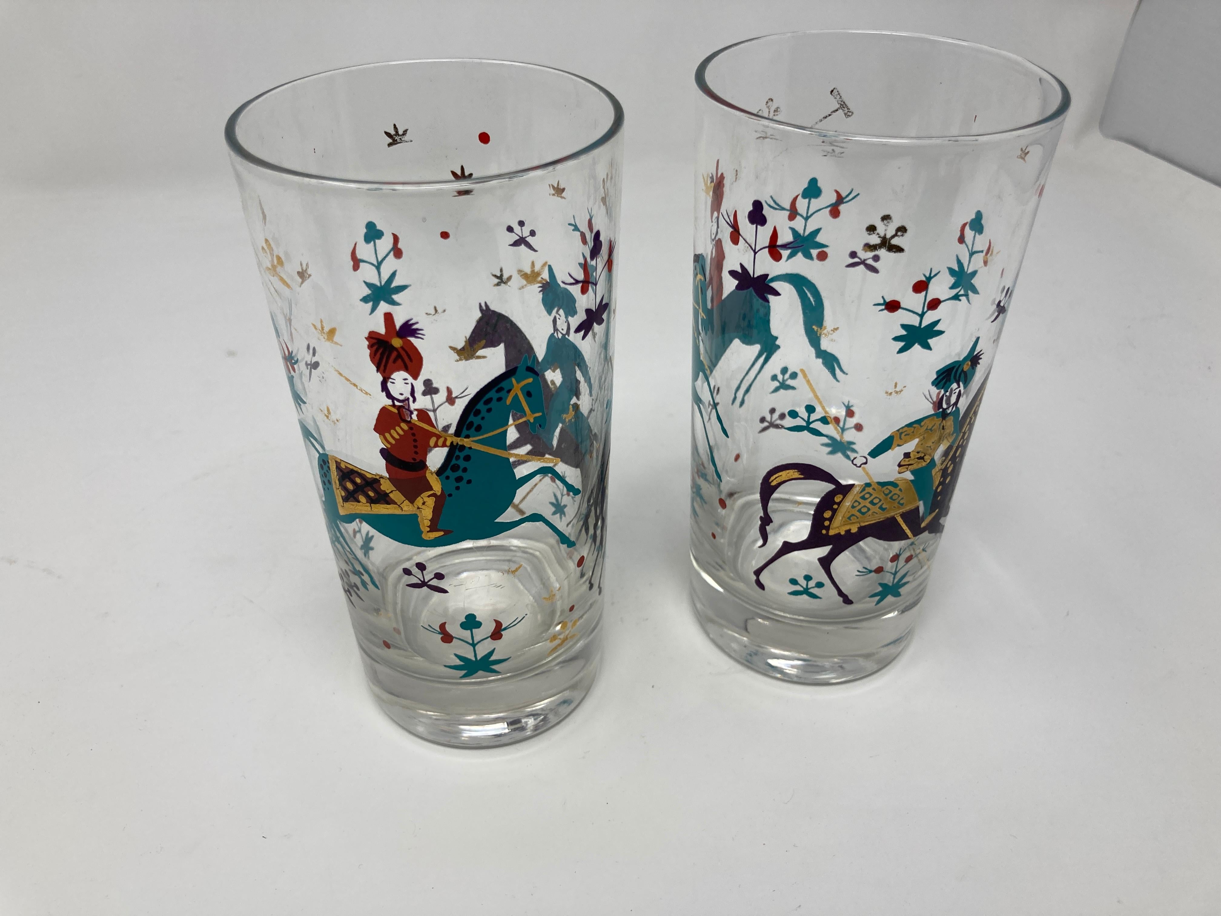 Elegant exquisite vintage set of two 50s-60s Turquoise and Gold Arabian Nights highball cocktail glasses.
A truly rare and unique set of Turquoise and gold decoration of Persian exotic polo players and their horses.
A hard to find pattern
