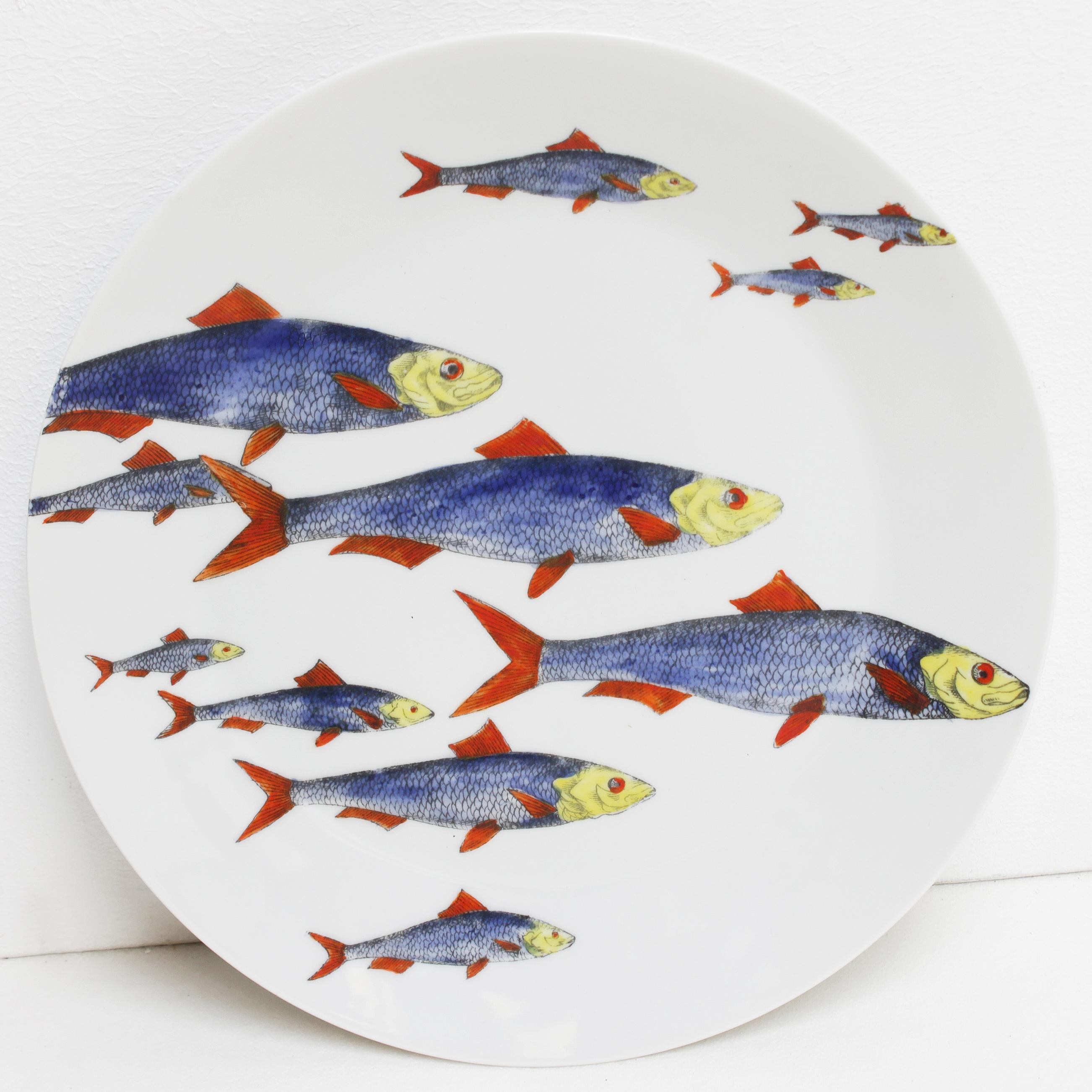 Complete set of six plates 'Passata di Pesce' (Passage of Fish) by Piero Fornasetti 1955.
Screen printed in black lines on German porcelain and painted in color by hand in the studio of Fornasetti in Italy. 
The plates are numbered, marked and