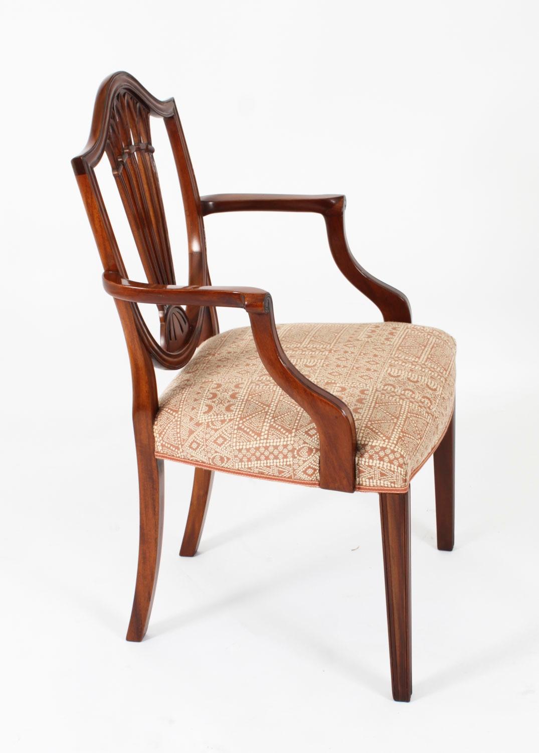 This fantastic set of ten Vintage wheatsheaf shieldback dining chairs date from the mid 20th Century.

Masterfully crafted in beautiful solid mahogany throughout and made by the renowned cabinet maker Brights of Nettlebed, the finish and attention