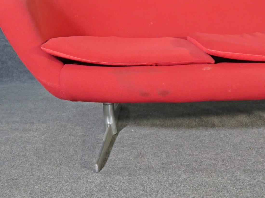 Vibrant Mid-Century Modern settee in the style of Overman, pairing bright red upholstery with a chrome frame. This vintage settee is a great statement piece as well as a comfortable addition to any room. Please confirm item location with seller