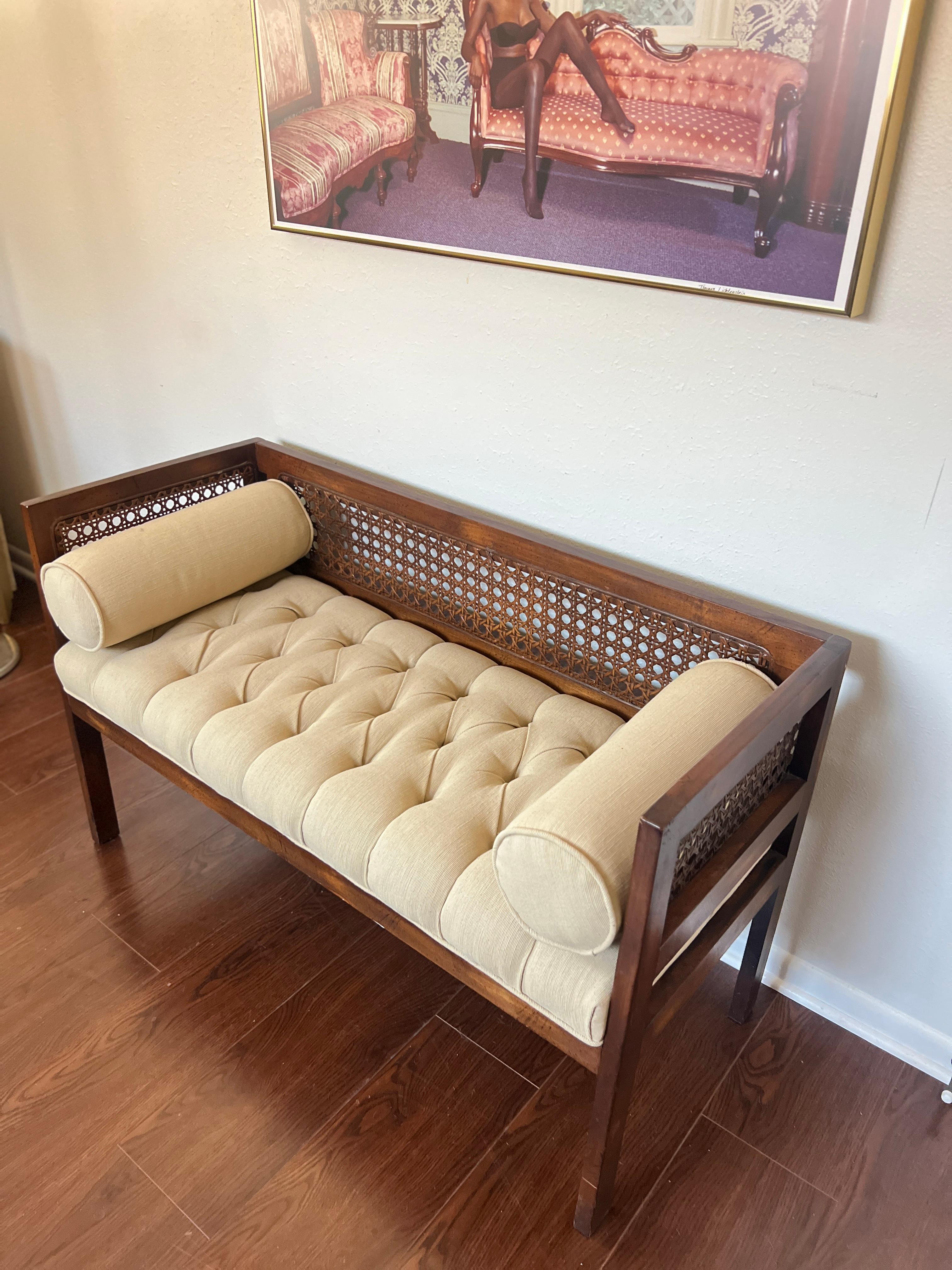 Vintage settee with a cane back and tufted seat in a cream color 5