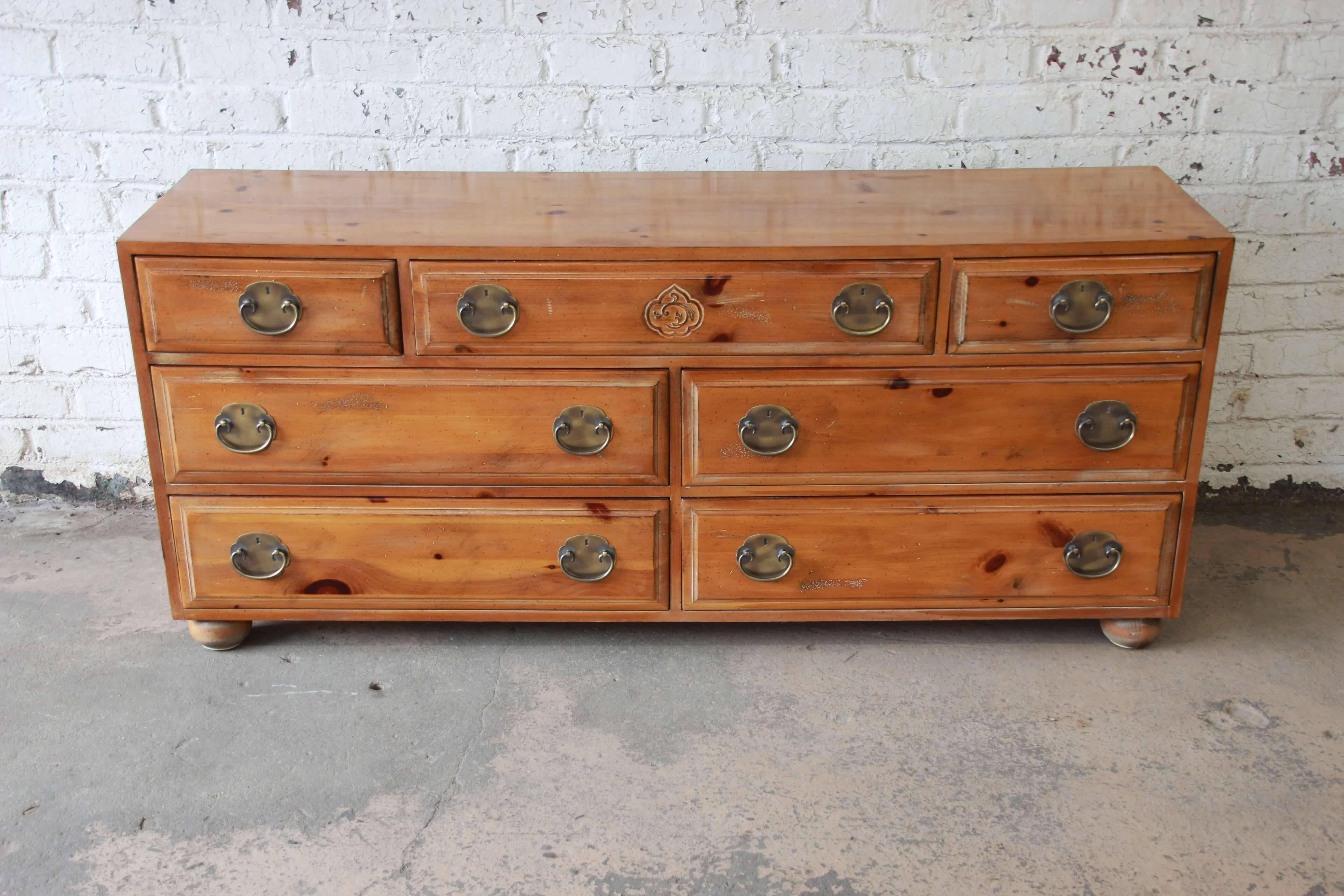 Offering a very nice solid pine seven-drawer dresser by Henrendon Furniture. The long dresser has large drawers offering ample room for storage along with brass hardware. The bottom of the dresser has four drawers and above are two smaller drawers