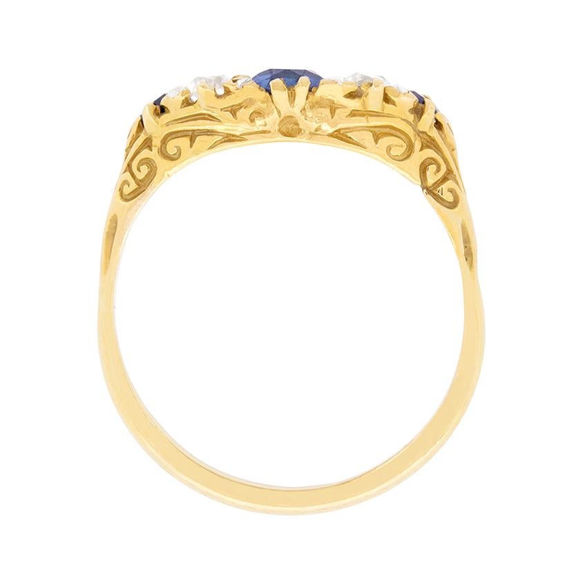 Set to centre an oval-shaped sapphire, this vintage 1930s era seven stone ring is set at each shoulder with another slightly smaller sapphire, all totalling 1.20 carats.

The sapphires alternate with two vertically-set old cut diamonds and four