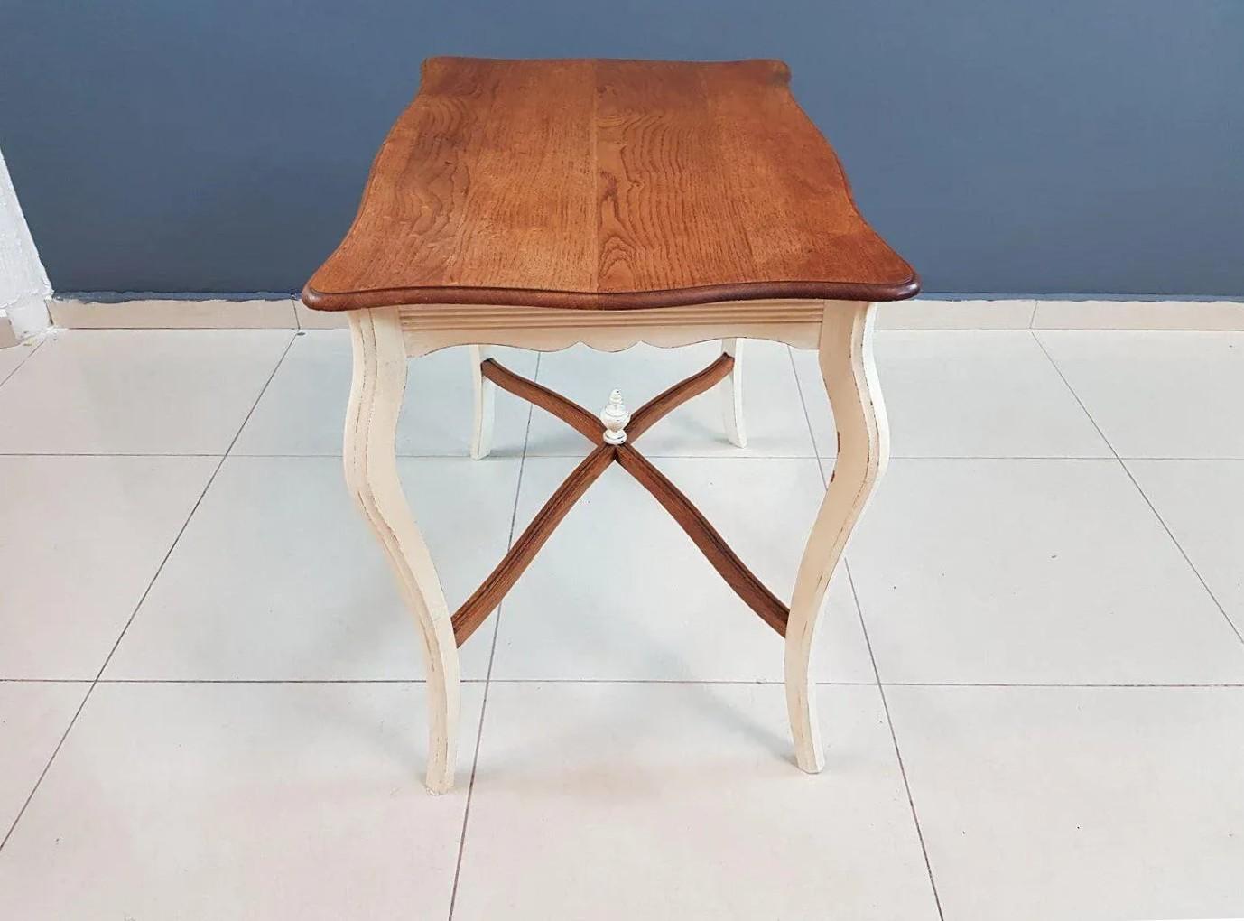 Dimensions: H 30.7” x W 35” x D 23.2”
Vintage French Louis XV style two-tone shabby chic wood side entry occasional table. Raised on sleek cabriole S-legs joined by an 