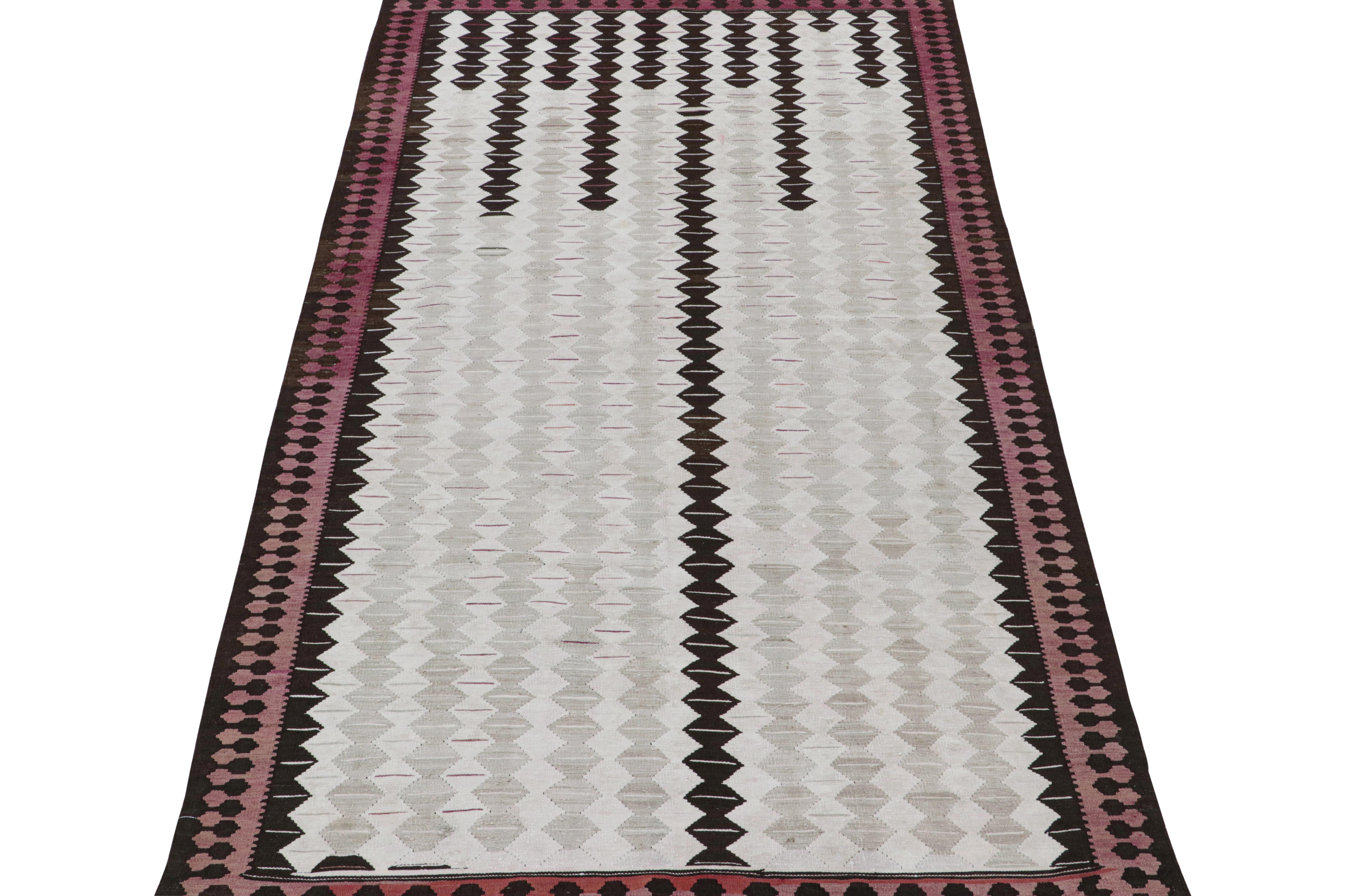 This vintage 6x10 Persian Kilim is a rare midcentury Shahsavan rug, believed to originate from the city of Qazvin. 

On the Design: 

Handwoven in wool circa 1950-1960, connoisseurs will note its unique colors, especially its many silver-gray
