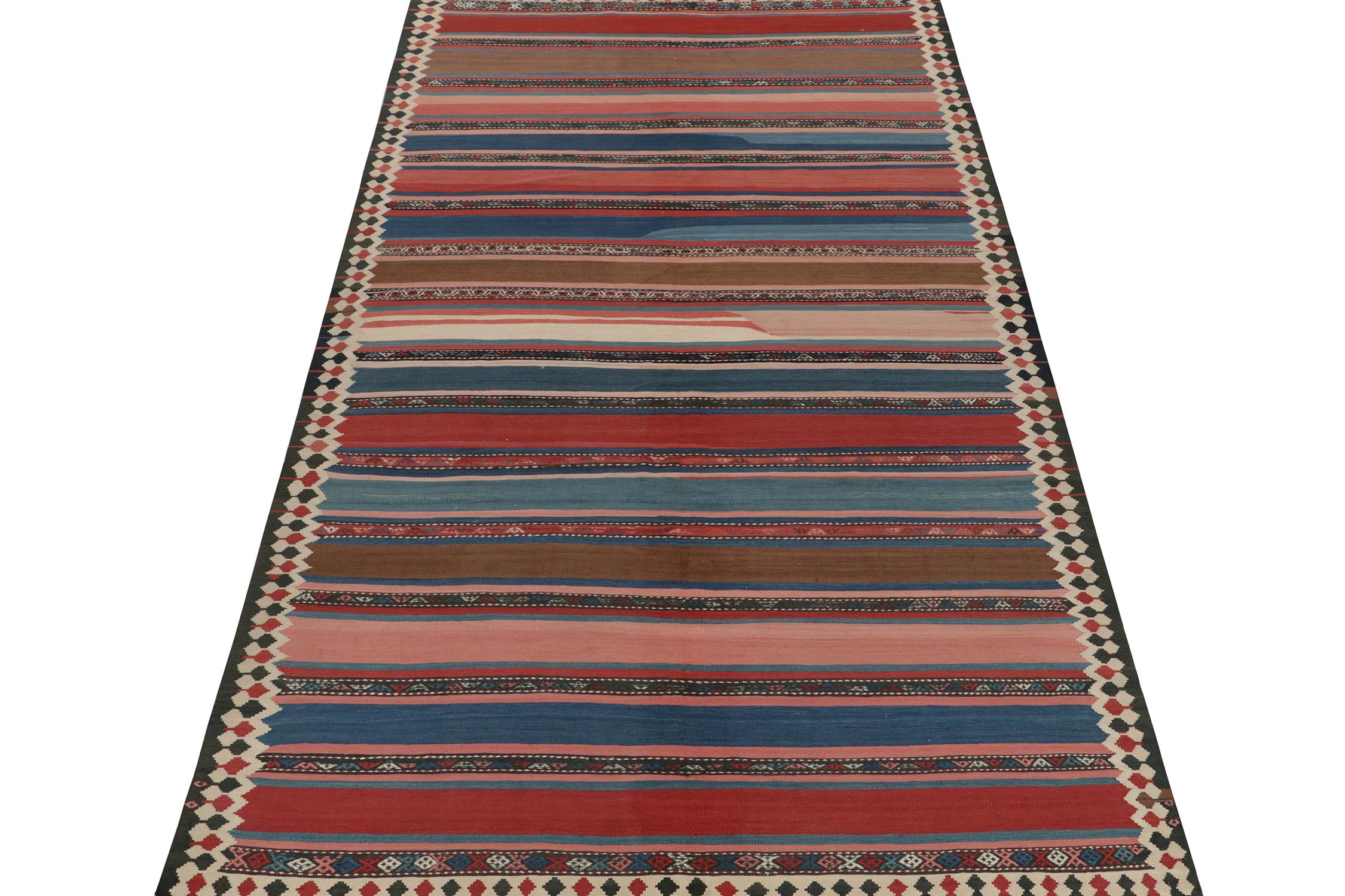 This vintage 6x12 Persian kilim is a Shahsavan tribal rug or outstanding provenance. Handwoven in wool, it’s believed to originate circa 1950-1960. 

Further on the Design:

The design prefers wide polychromatic stripes in the field, wrapped in rich