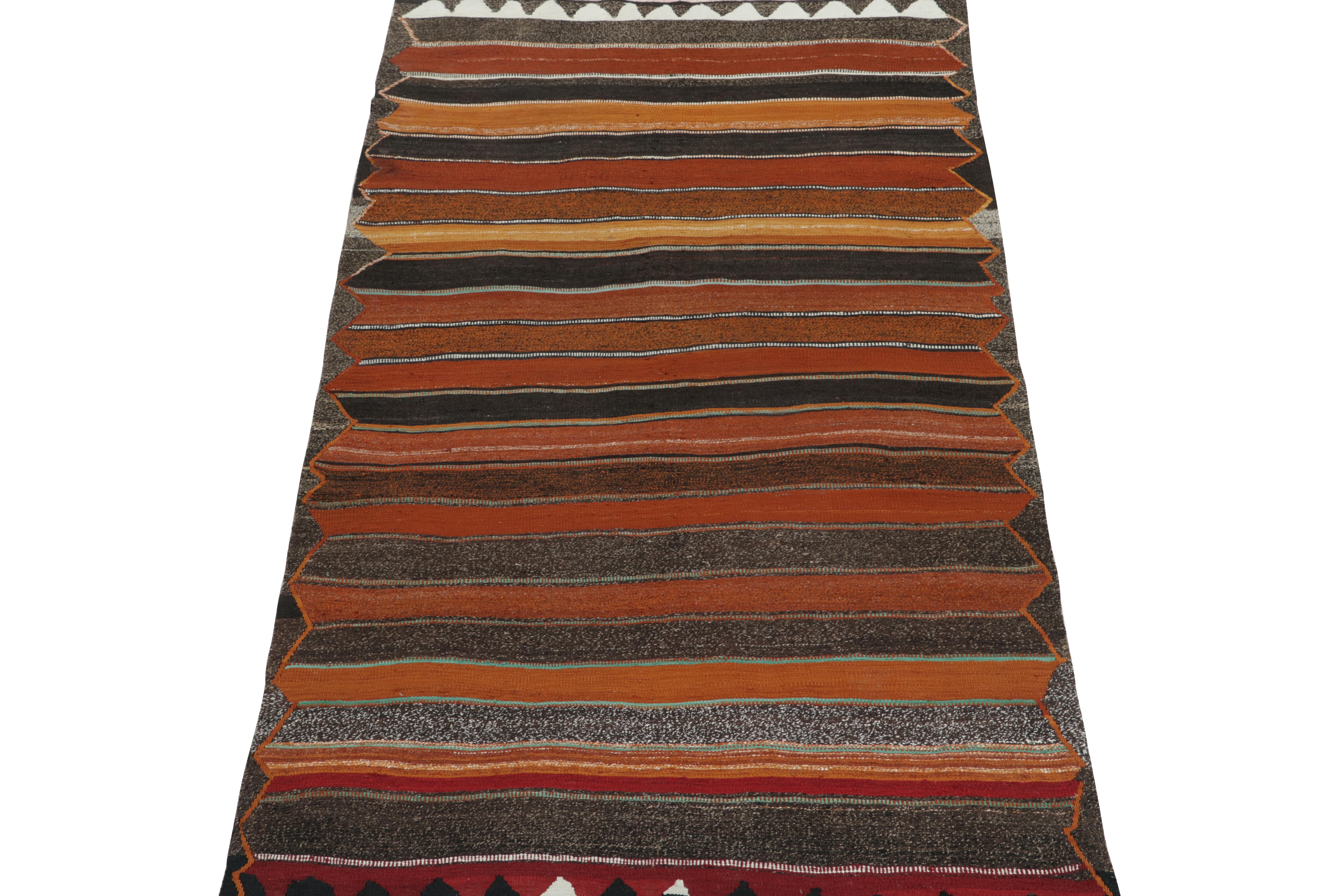 This vintage 5x9 Persian Kilim is a tribal rug we believe to be of Shahsavan provenance. Handwoven in wool, it originates circa 1950-1960.

Further on the Design:

The bold design prefers polychromatic stripes on a slate gray undertone and border