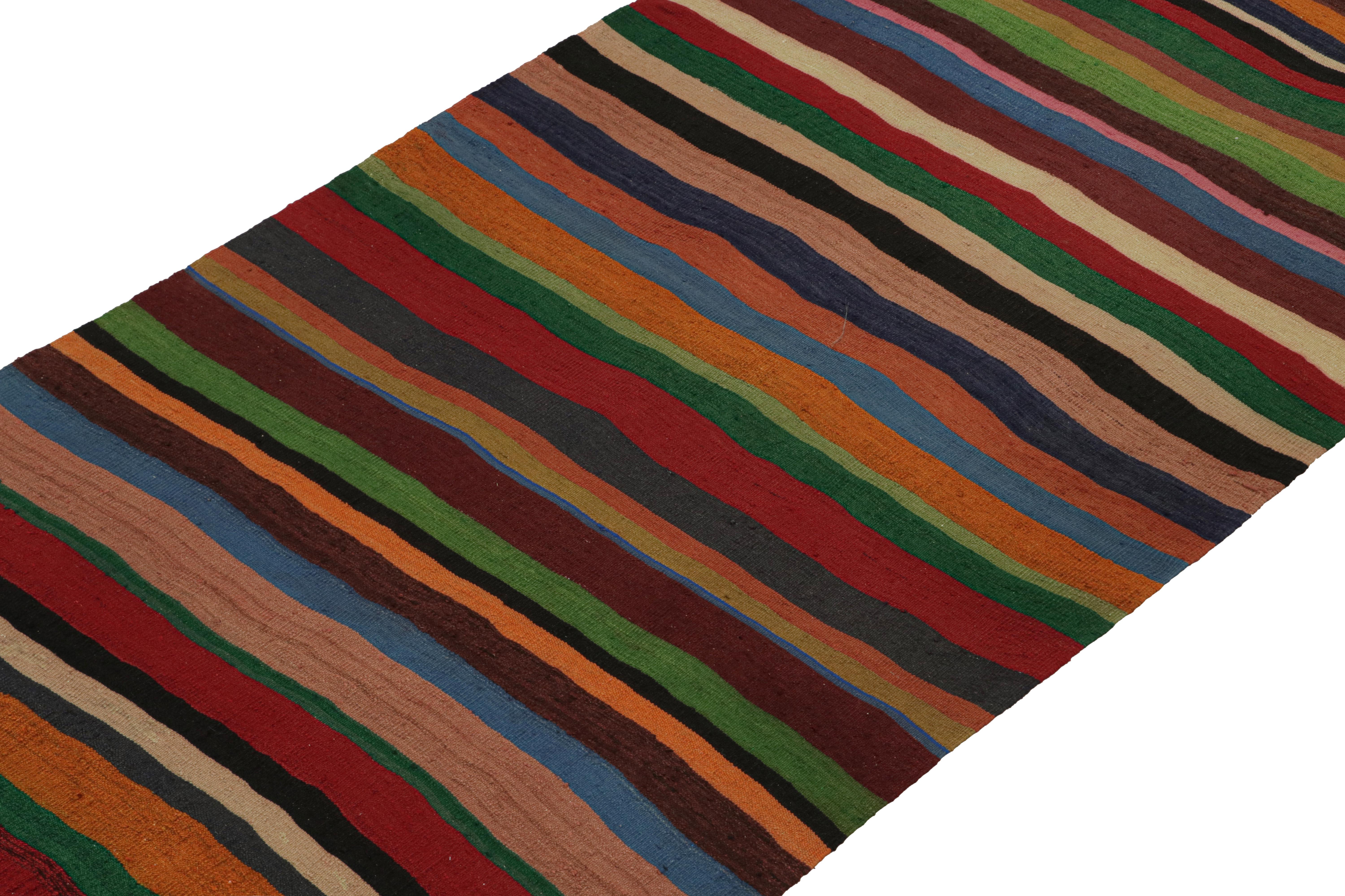 This vintage 4x13 Persian Kilim is believed to be a midcentury Shahsavan rug, handwoven in wool circa 1950-1960.

On the Design: 

This flat weave enjoys an all over pattern with stripes in rich and saturated polychromatic colorways. It’s a
