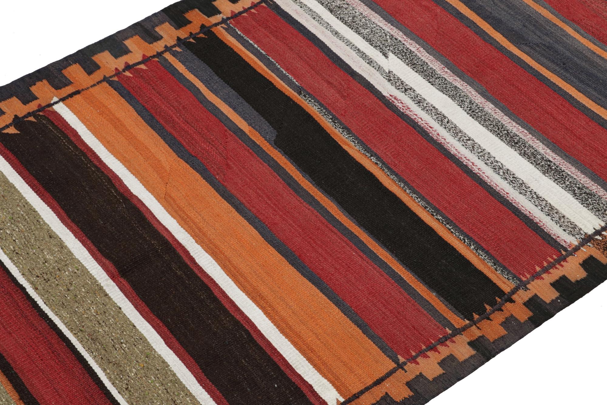 This vintage 4x9 Persian kilim is believed to be a mid-century Shahsavan tribal rug—handwoven in wool circa 1950-1960.

On the Design:

This particular Shahsavan rug enjoys stripes in many deep, warm and rich tones in its polychromatic