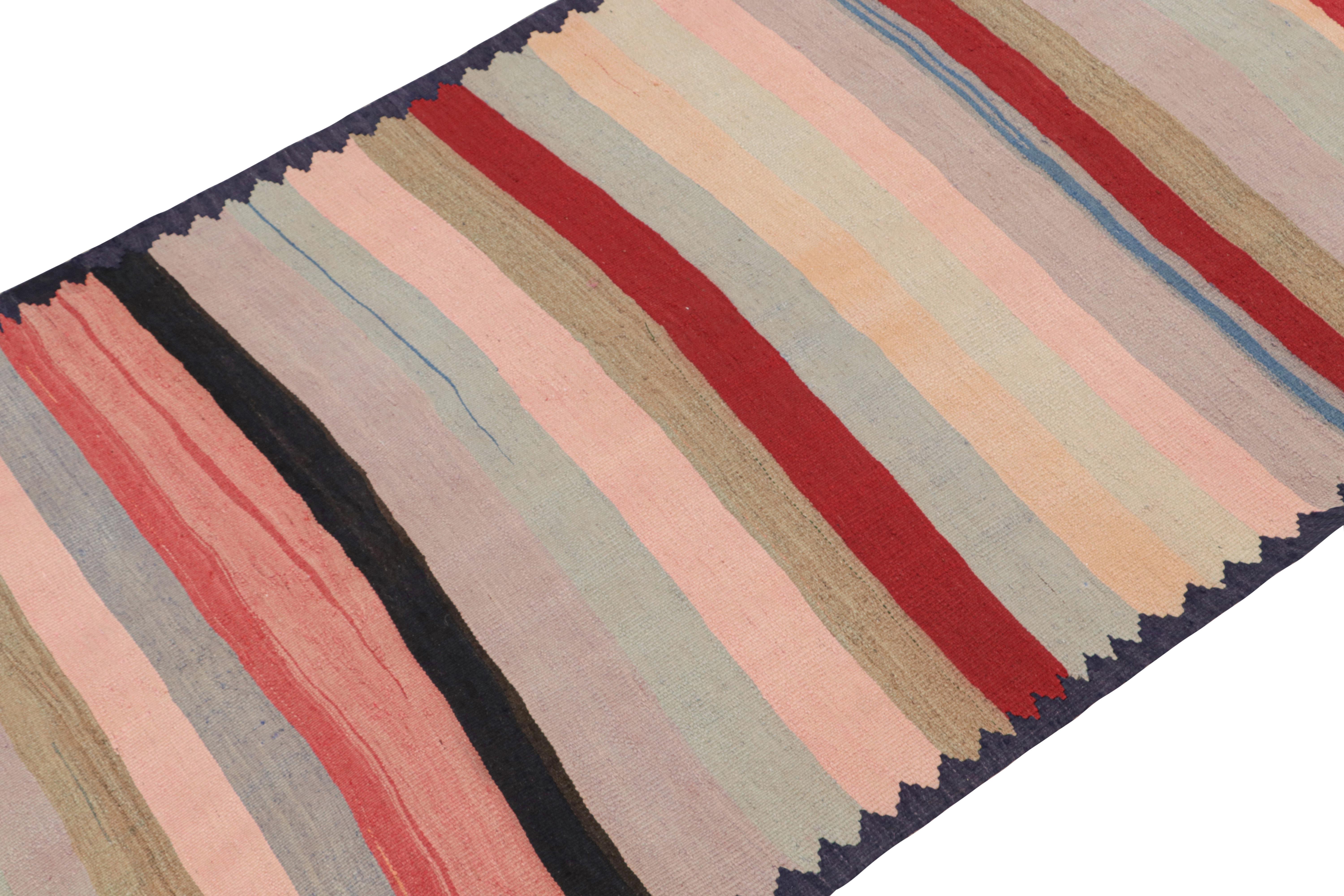 This vintage 4x10 Shahsavan Persian Kilim is handwoven in wool, and originates circa 1950-1960.

On the Design: 

This piece enjoys geometric & striped patterns in red, brown, blue, pink & black - exemplifying tribal aesthetics of the Shahsavan