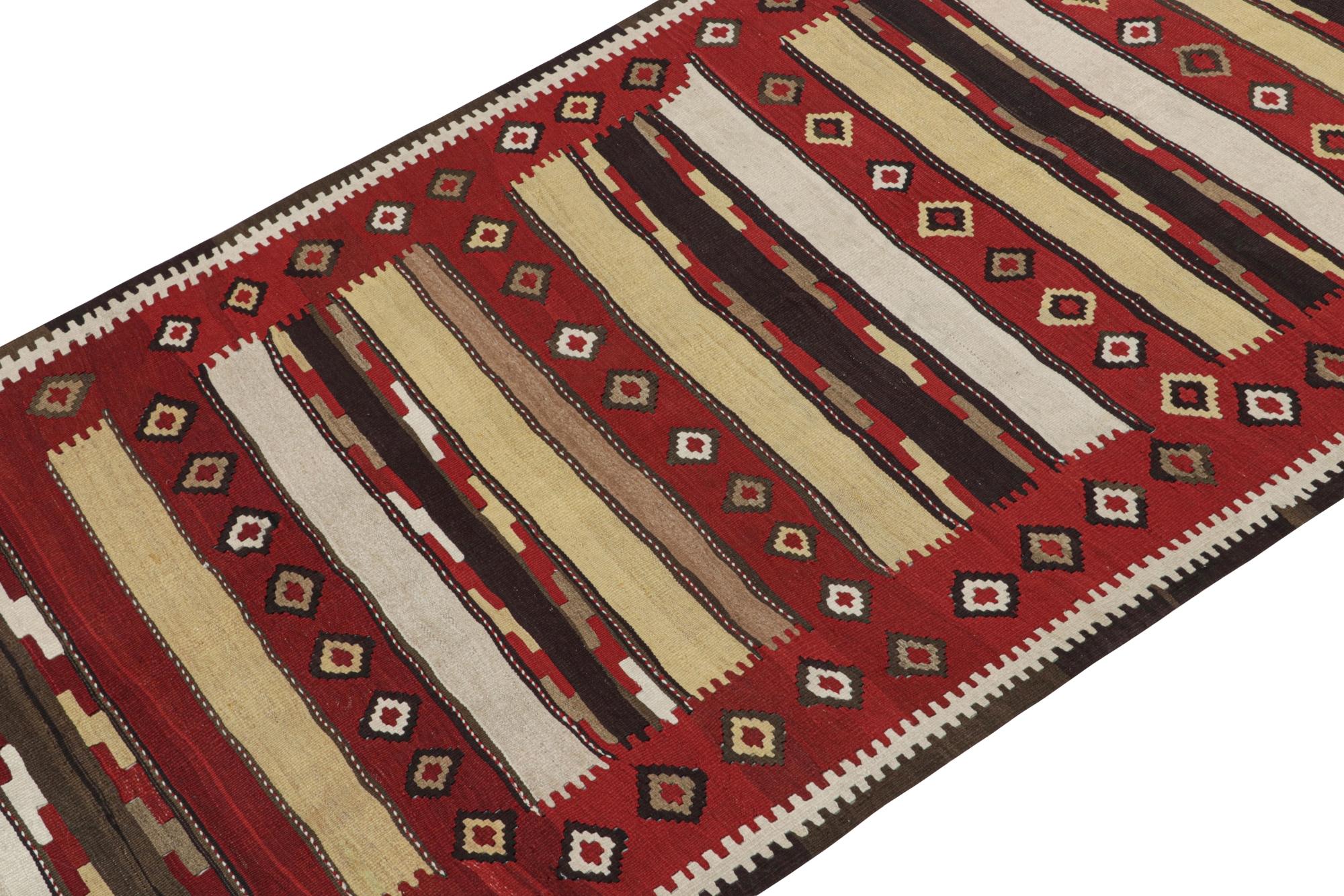 This vintage 5x11 Persian kilim is believed to be a Shahsavan tribal rug, handwoven in wool circa 1950-1960.

On the Design: 

This mid-century rug enjoys a complementary play of stripes and traditional geometric patterns. Its colorway favors a