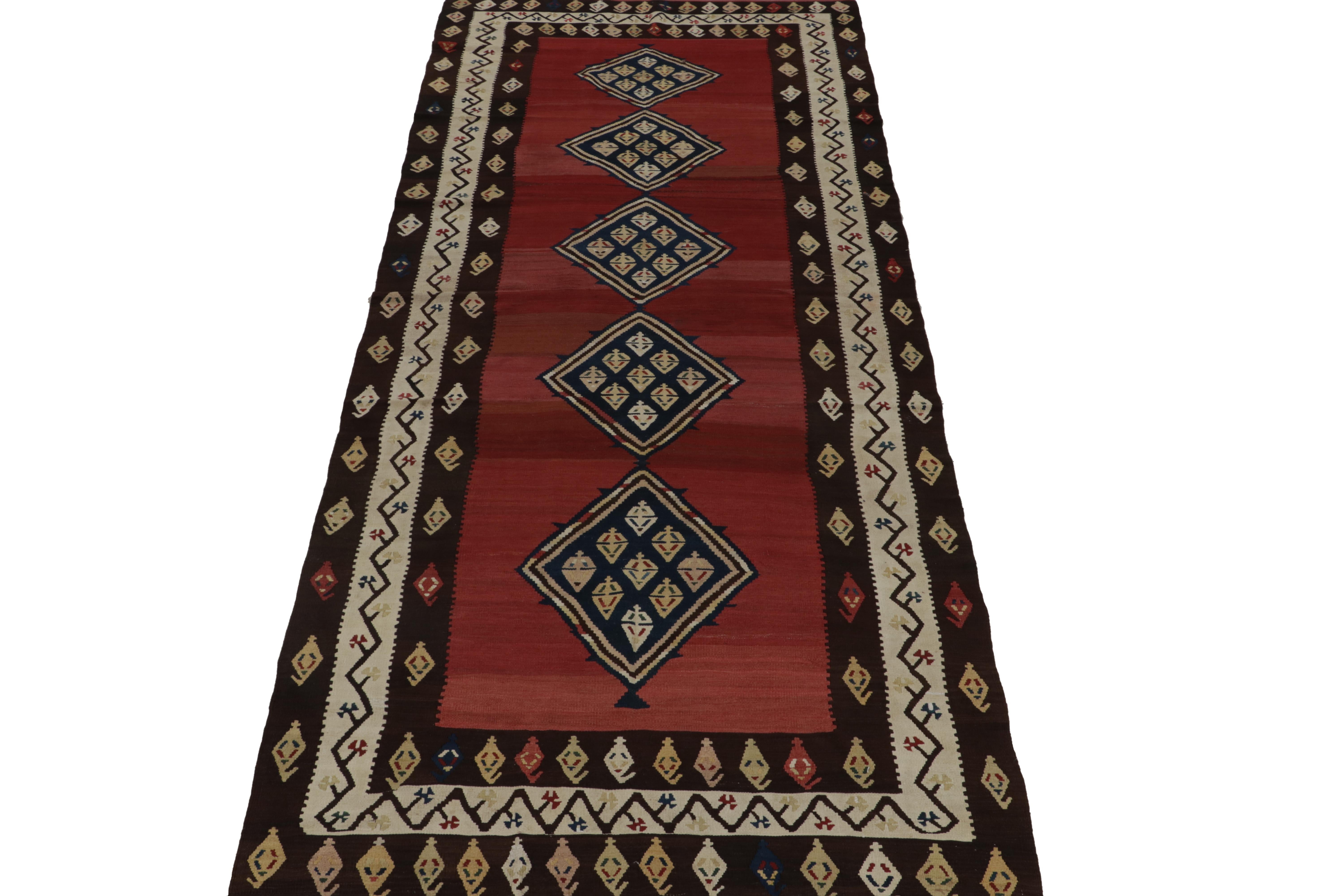 This vintage 6x13 Shahsavan kilim is a distinct gallery rug in Rug & Kilim’s Persian tribal curations. Handwoven in wool, it’s believed to originate circa 1950-1960. 

Further on the Design:

The design prefers blue medallions on a red open