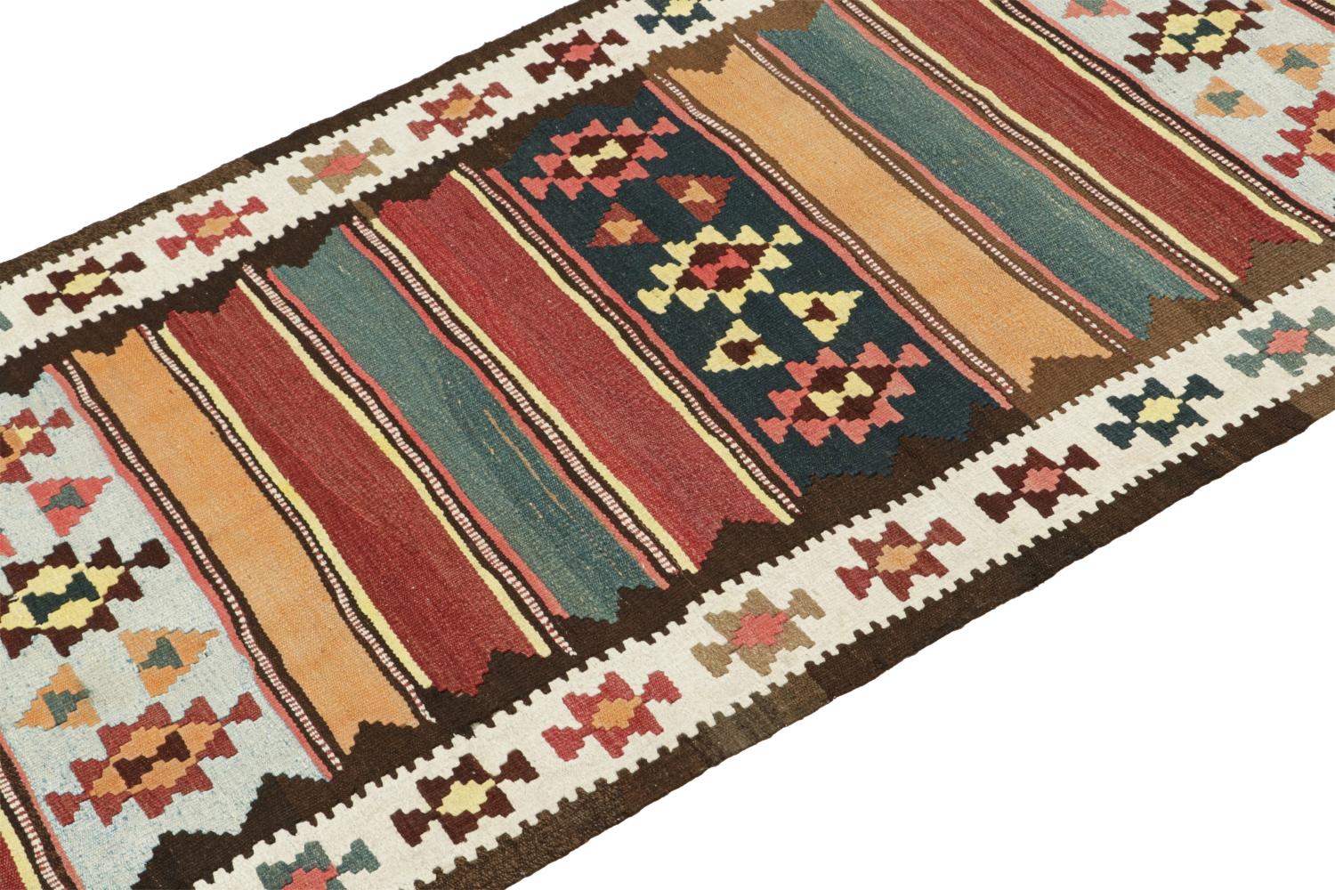 This vintage 4x10 Persian Kilim is a midcentury tribal rug that we believe originates from the Shahsavan tribe. 

On the Design:

Handwoven in wool circa 1950-1960, its design enjoys a complementary play of stripes & tribal geometric patterns in