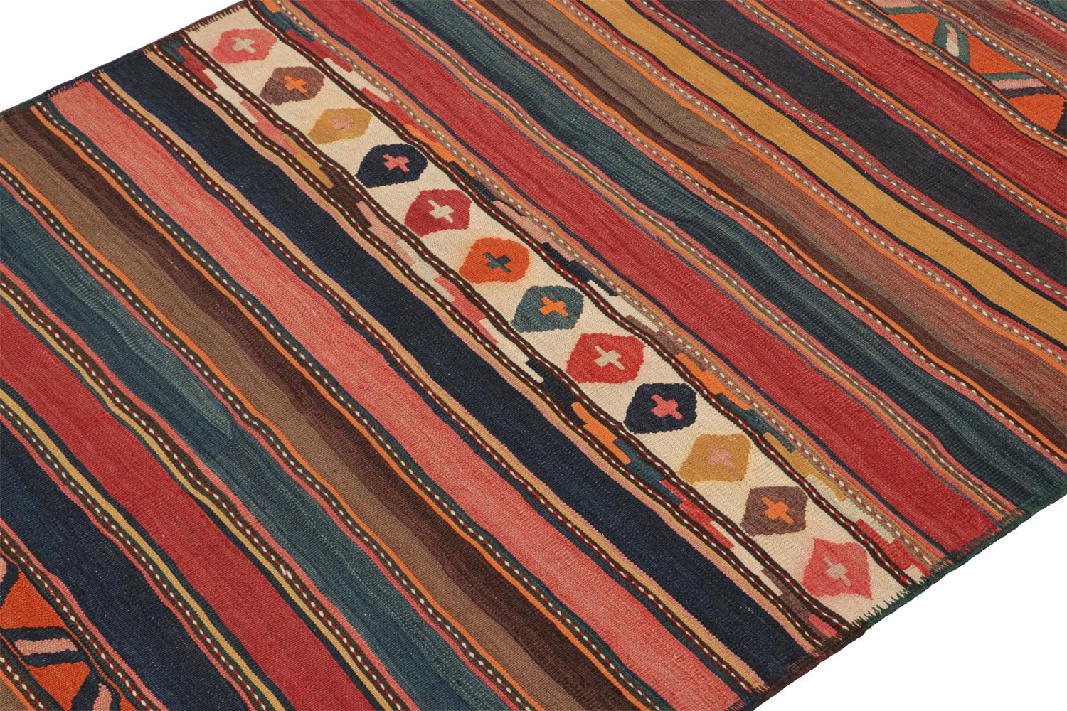 This vintage 5x9 Persian Kilim is a midcentury tribal rug that we believe originates from the Shahsavan tribe. 

On the Design:

Handwoven in wool circa 1950-1960, its design enjoys a colorful play of stripes and geometric patterns. Keen eyes