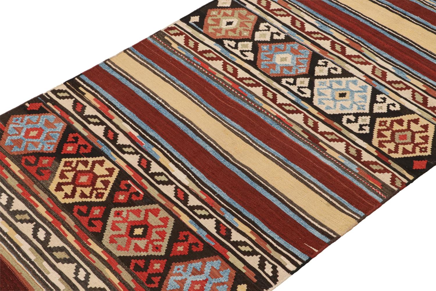 This vintage 4x12 Persian Kilim is a mid-century tribal rug believed to originate from the Shahsavan tribe. 

On the Design:

Handwoven in wool circa 1950-1960, its design enjoys a play of stripes and geometric patterns in rich red, beige-brown