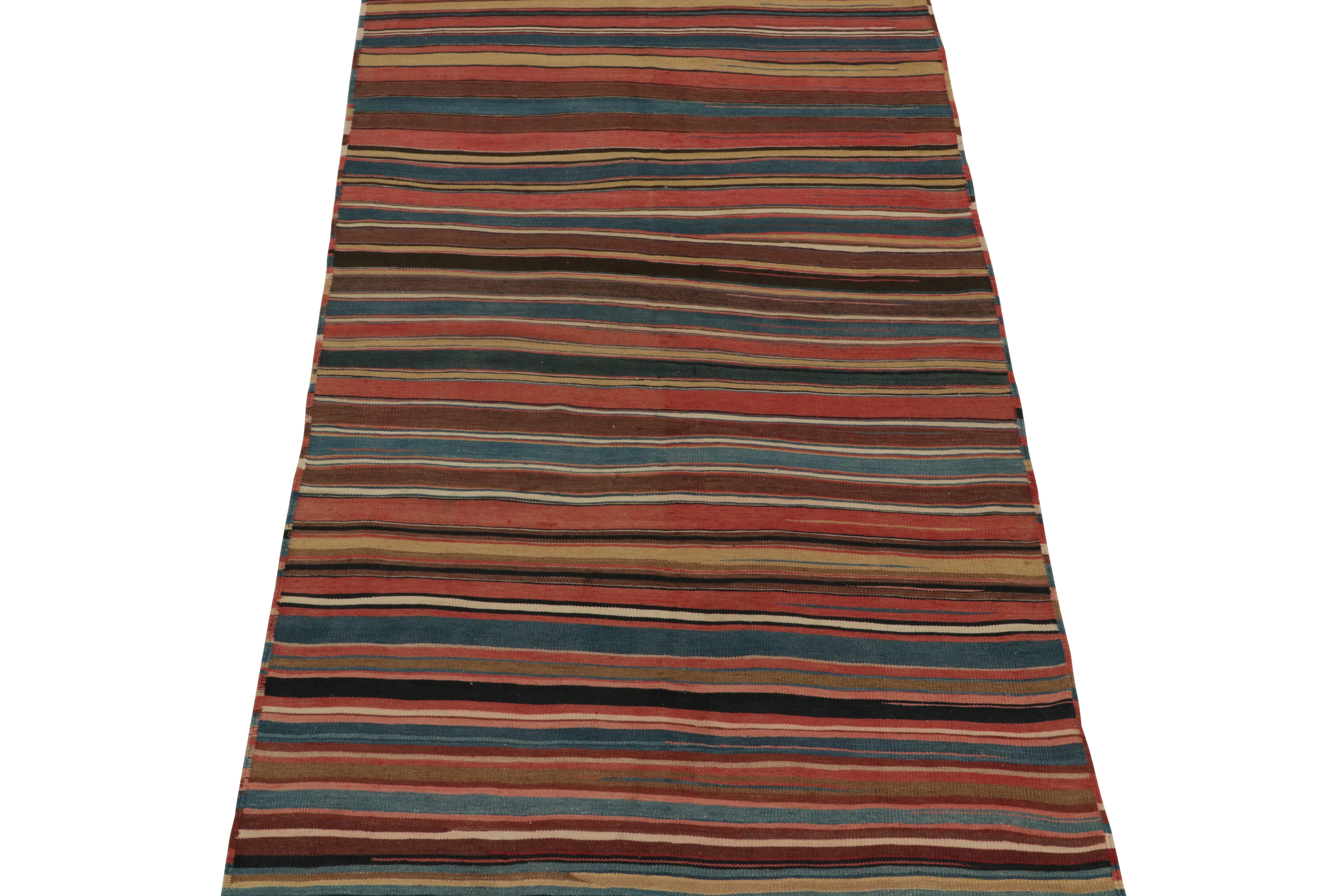 This vintage 5x9 Persian kilim is a unique tribal rug for its period and provenance. Handwoven in wool, it’s believed to be of Shahsavan provenance and originates circa 1950-1960. 

Further on the Design:

The field hosts horizontal stripes