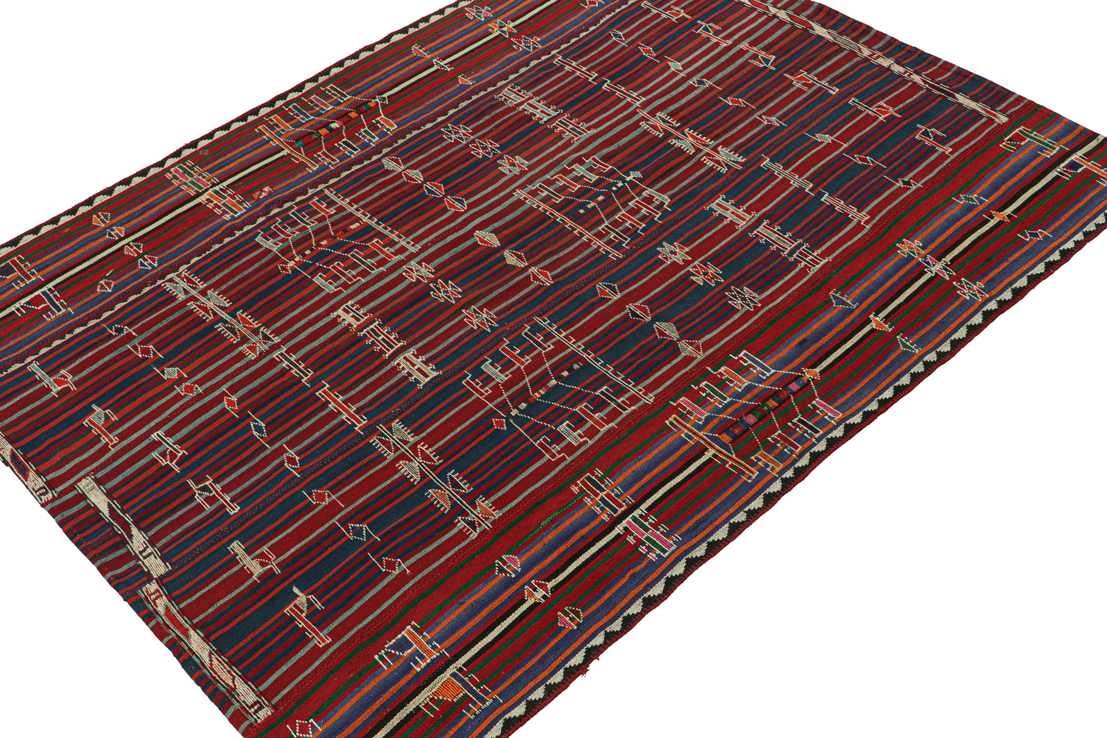This vintage 7x9 Shahsavan kilim is a unique tribal rug for its period—hailing from Persia circa 1950-1960. Handwoven in wool.

Further on the Design:

The field hosts stripes and embroidered motifs in navy blue and red with orange and pink