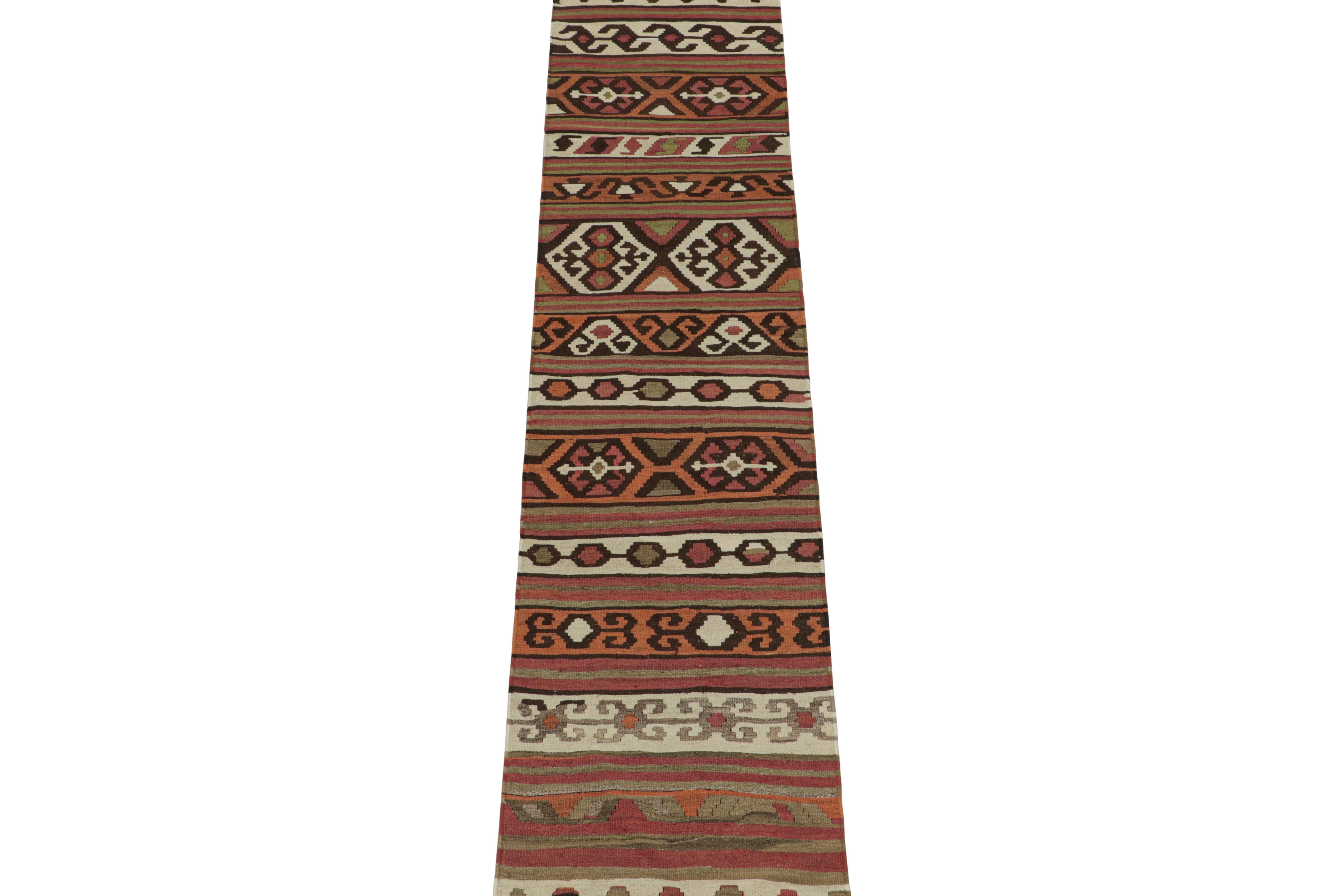 This vintage 2x11 Persian Kilim runner is believed to be a Shahsavan tribal rug. Handwoven in wool, it originates circa 1950-1960 and enjoys an interesting polychromatic design in geometric patterns.

Further on the Design:

Among many warm reds