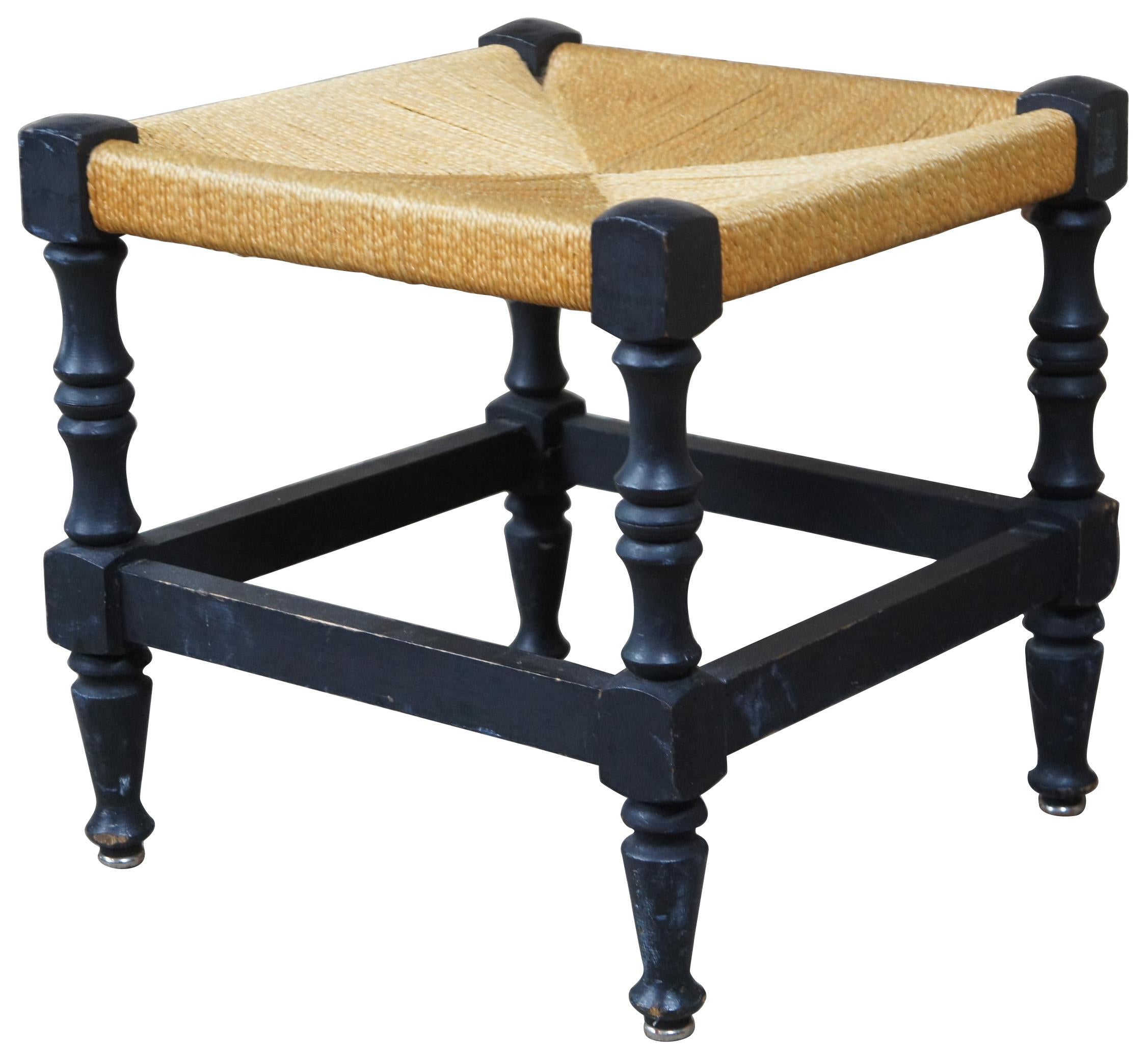 Vintage Shaker style stool or footrest. Features woven seat, black painted finish with turned baluster supports and metal capped feet. Measures: 15