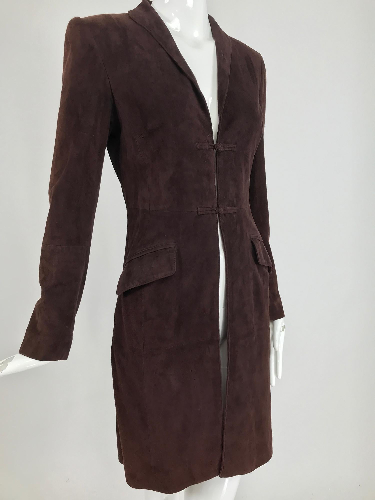 Vintage Shanghai Tang 1930s inspired dark wine lamb suede coat from the 1990s. A line coat closes at the front with two suede frogs, narrow notched lapel collar and long sleeves that have knotted suede buttons at each cuff. The suede is extra soft