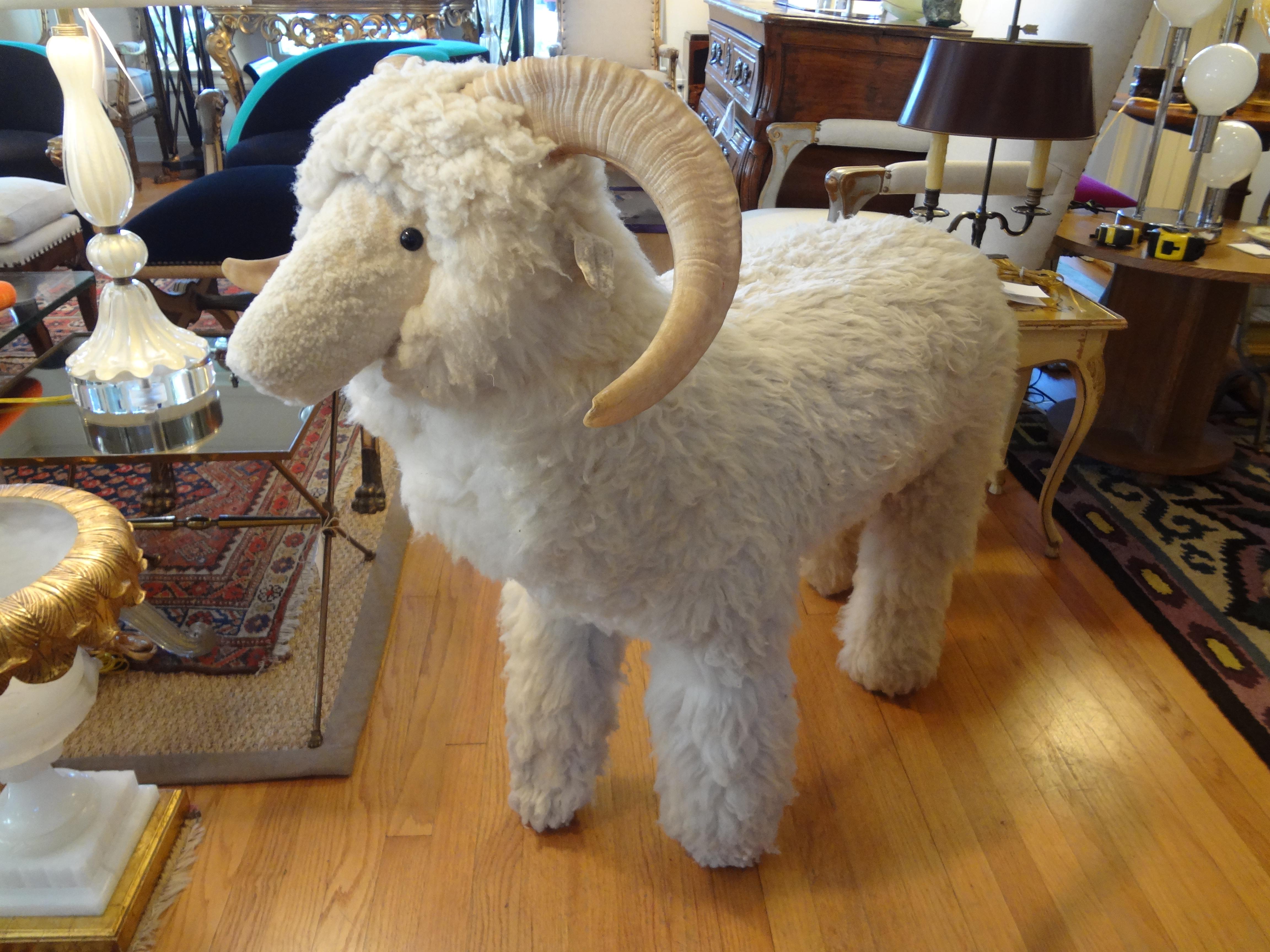 Large realistic sheep or lamb sculpture, bench or ottoman made of wood and covered with genuine shearling sheep fur and horns, circa 1967.
Dimensions: 36 inches high, 19 inches wide and 39 inches length.