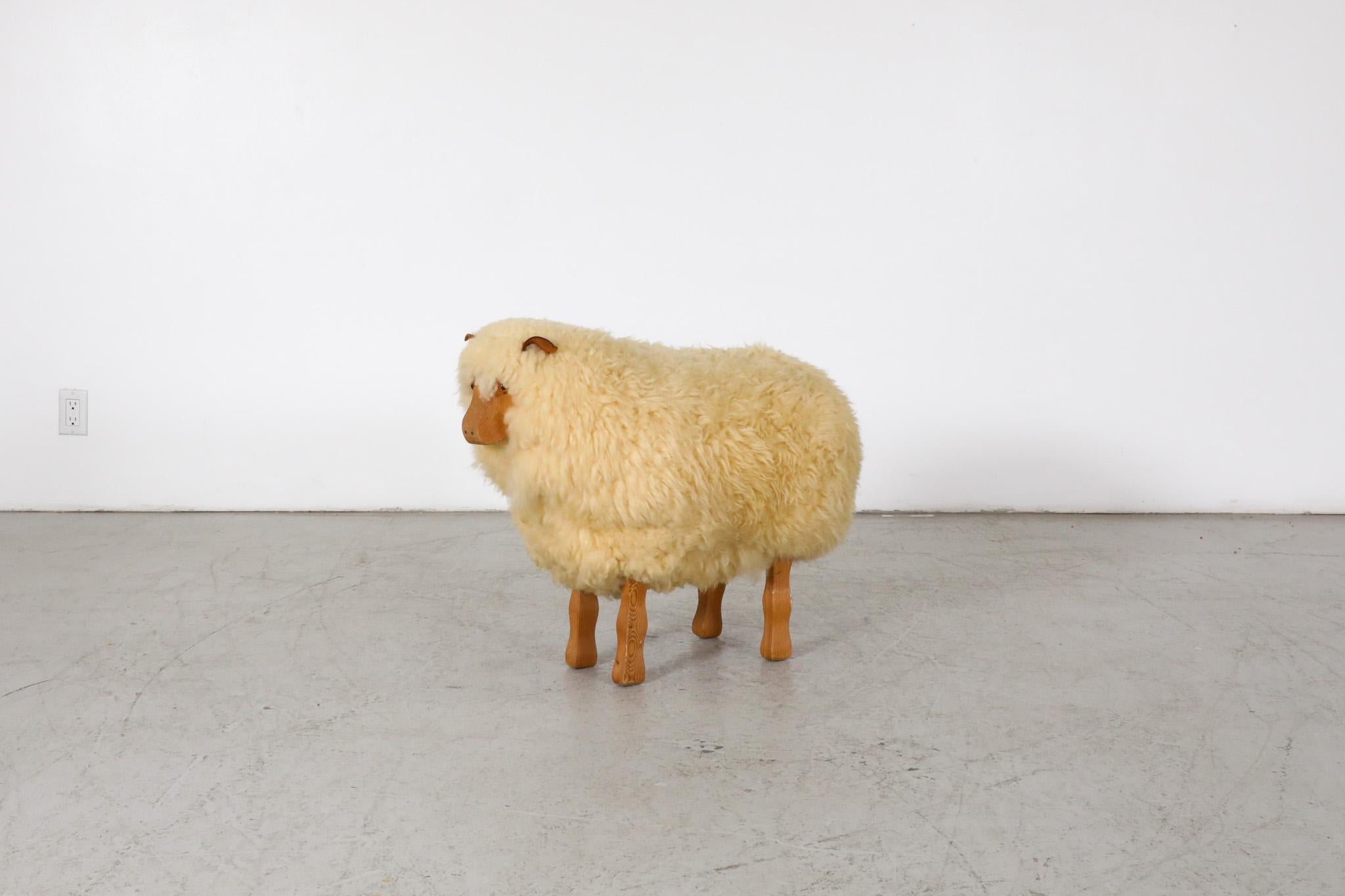 Petite, vintage, Hans Peter Krafft wooden sheep outfitted with real wool sheep coat. Has hand carved face and feet and natural leather ears. It is in original condition with some wear and patina, all consistent with age and light use.