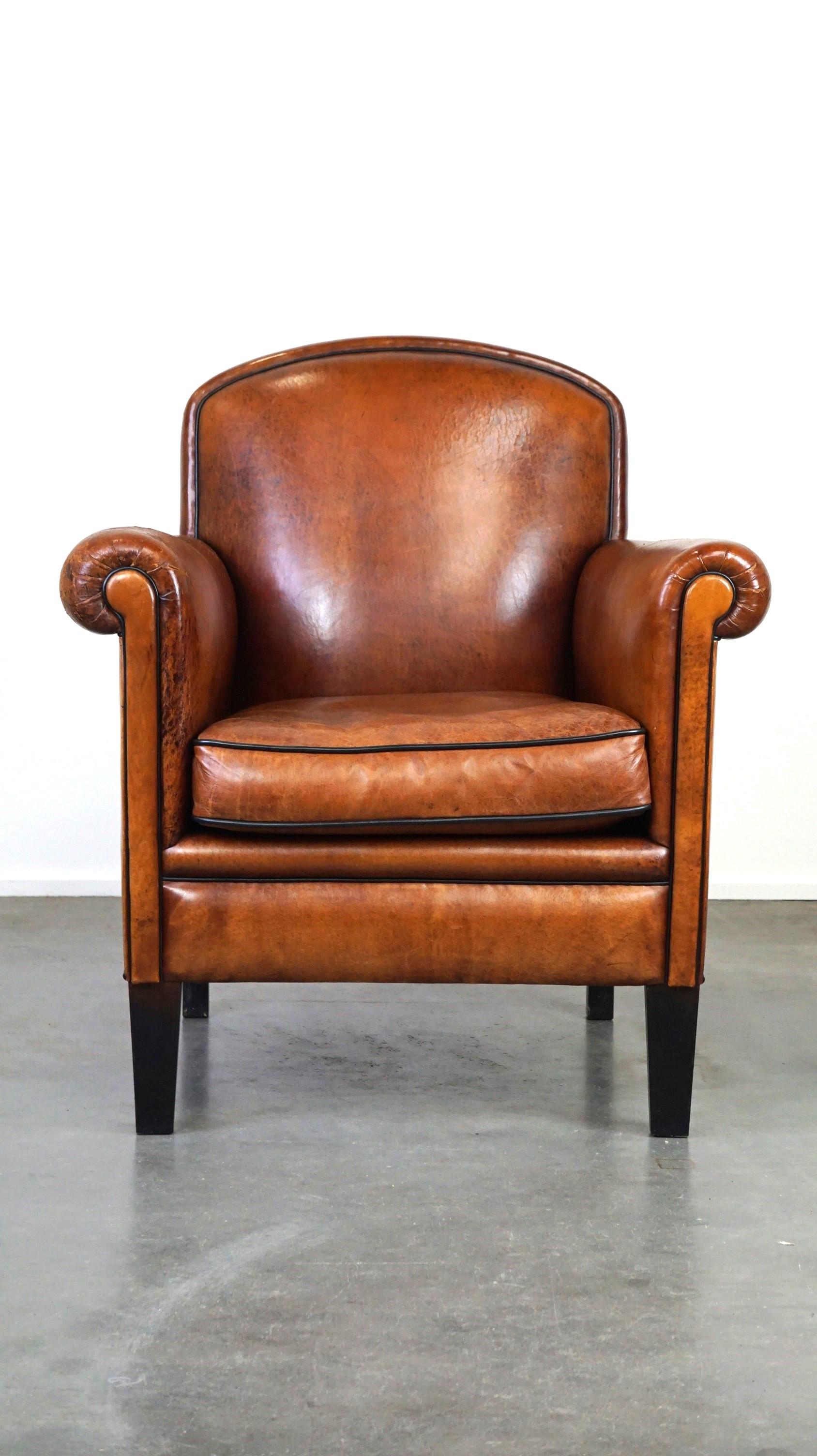 Offered: this vintage sheepskin armchair/design chair with a nice look and good comfort.

This charming vintage armchair has a warm color and is made of sheepskin leather. It can be easily placed in almost any interior and offers comfortable