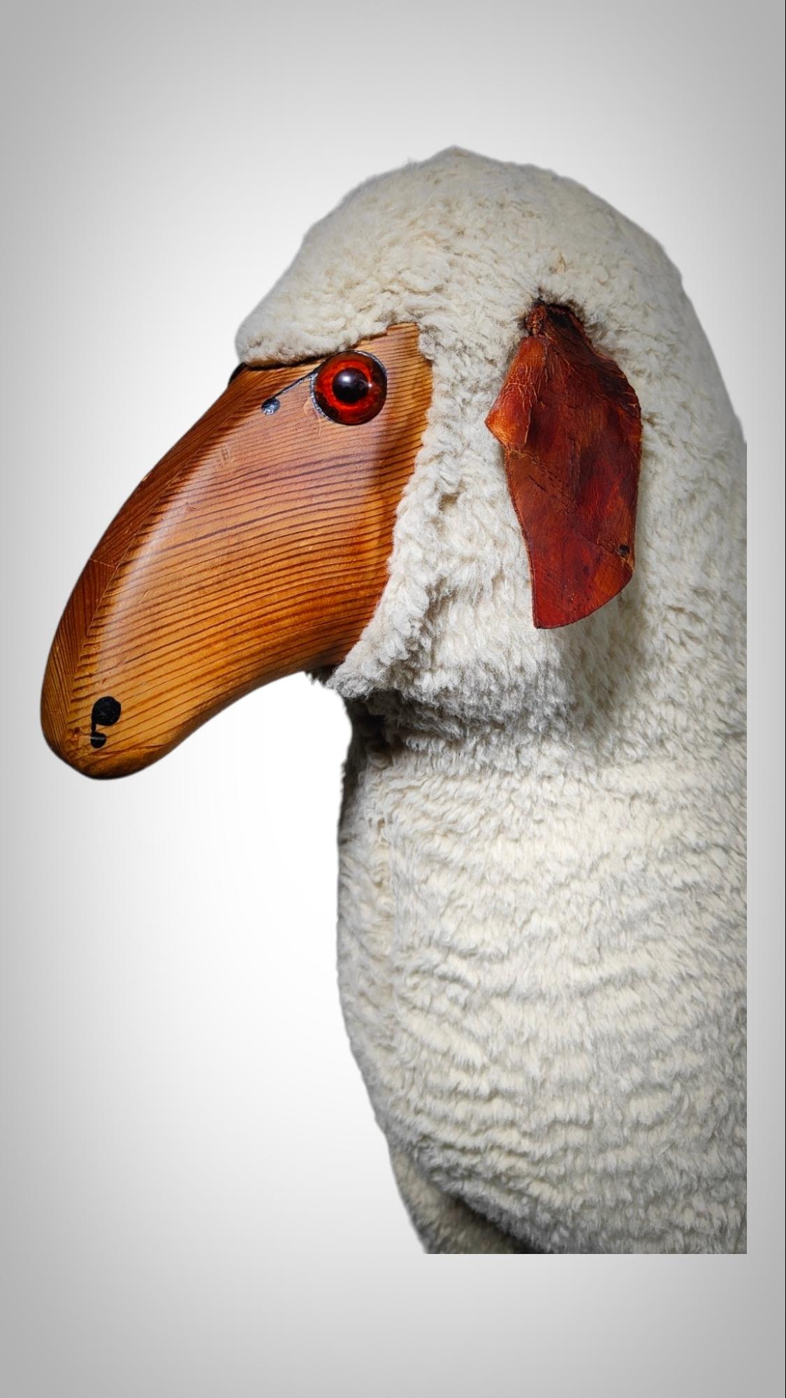 Vintage Sheep Sculpture in the Style of Francois- Xavier Lalanne
Style of Francois-Xavier Lalanne (French, 1927-2008). Figural sheep sculpture composed of teak wood, sheepskin, wool, and orange glass eyes. The sheep is attentive and stares directly