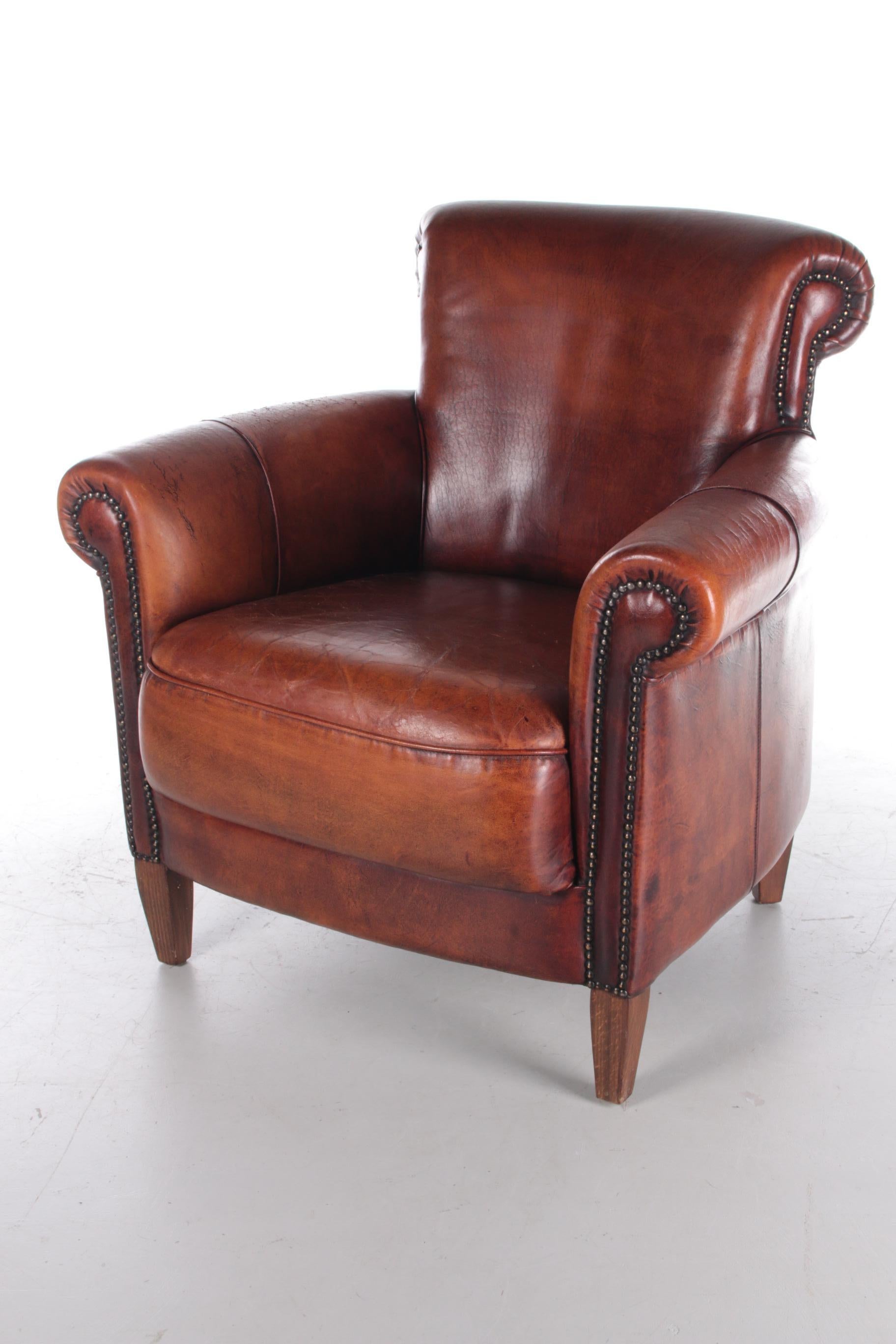 Vintage Sheepskin Armchair with a Beautiful Brown Patina For Sale at 1stDibs
