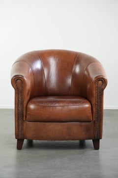 Vintage sheepskin club armchair in English style with deep colours