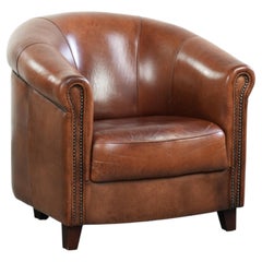 Vintage sheepskin club armchair in English style with deep colours