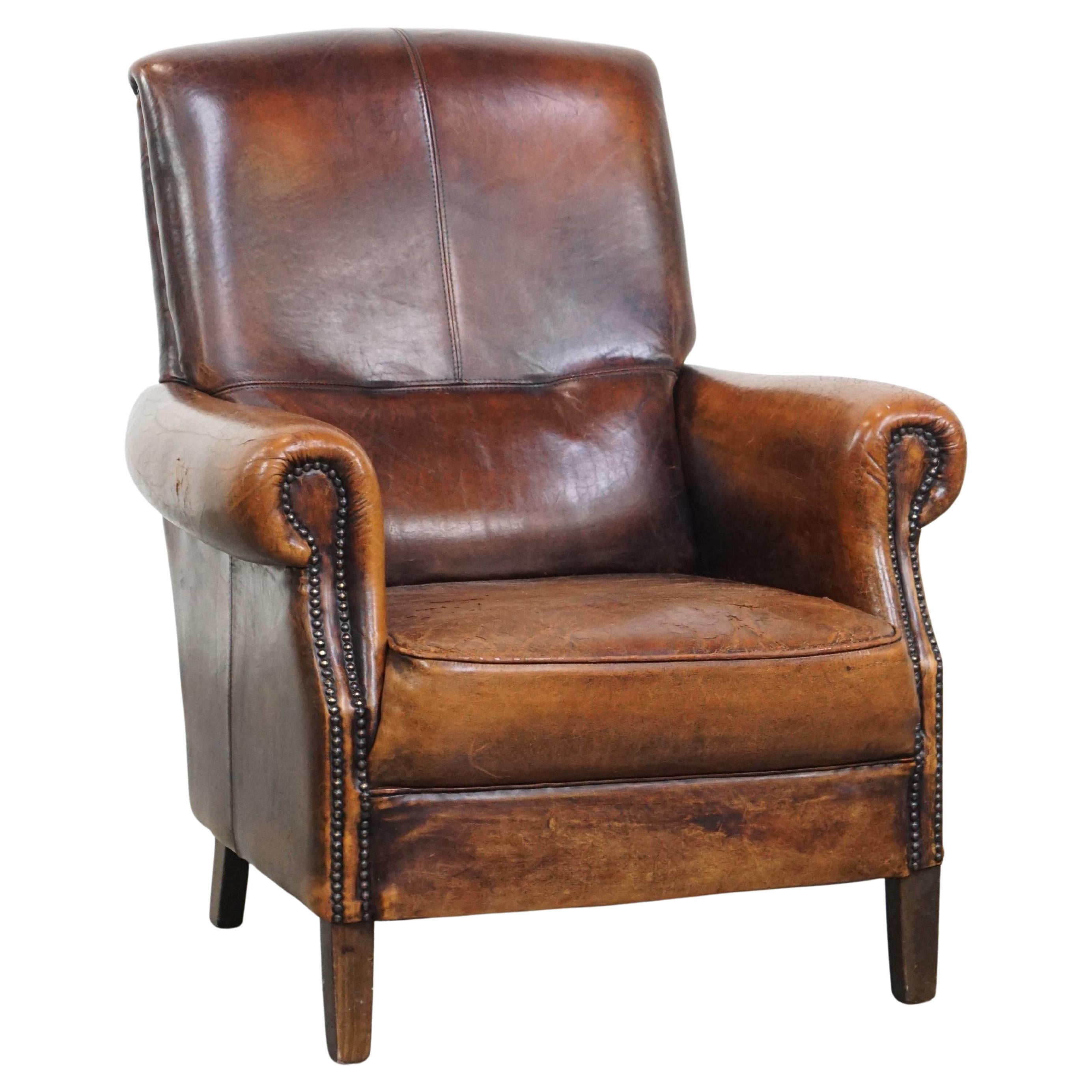 Sillón vintage de piel de oveja con respaldo alto