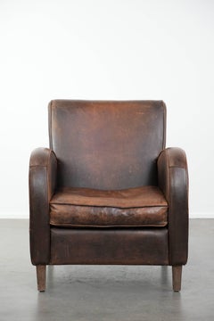 Sillón vintage de diseño de piel de oveja en color coñac oscuro