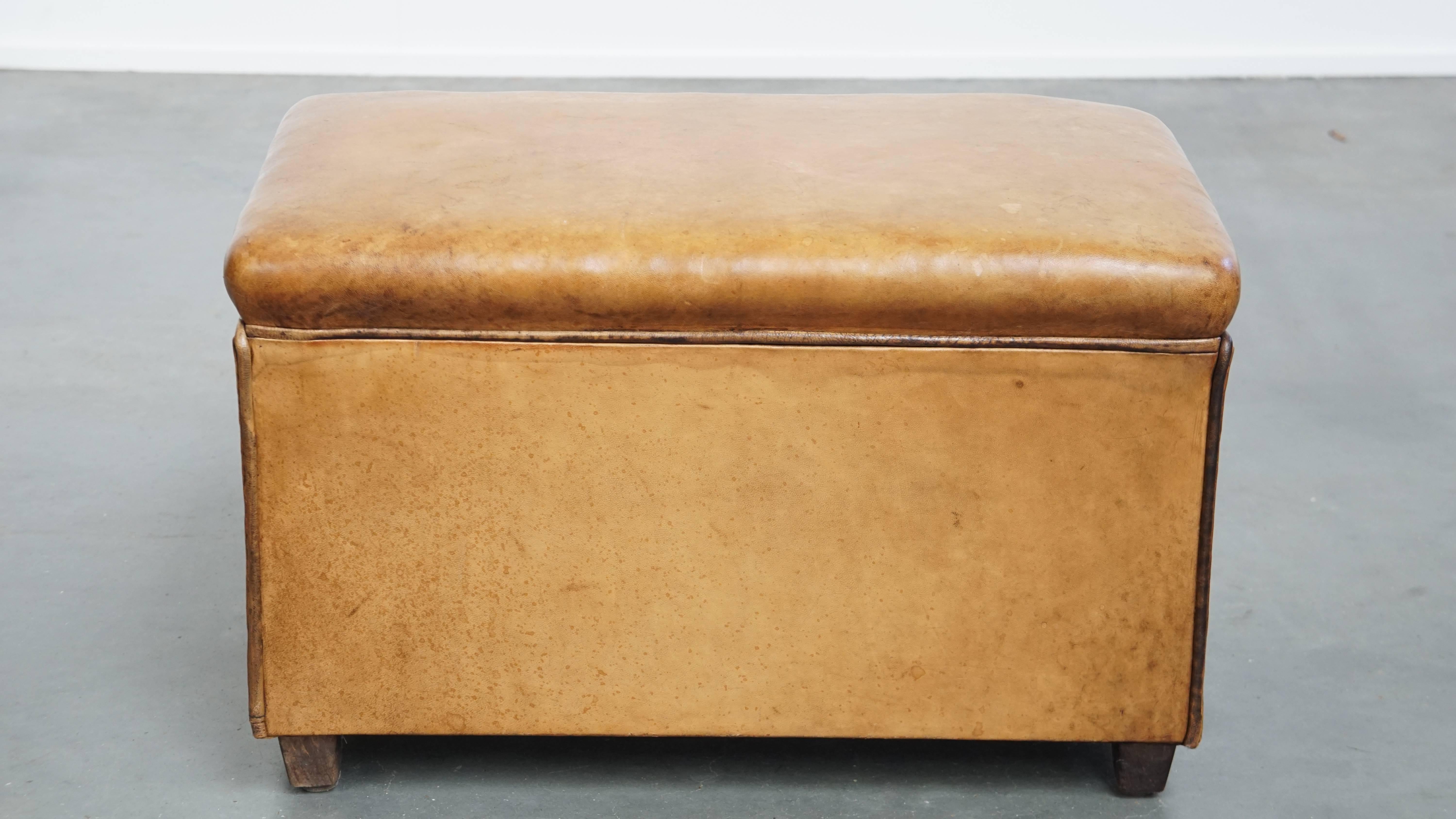 Offered here is this stunning vintage sheepskin leather designer ottoman by Bart van Bekhoven. 

A sheepskin leather footstool—also known as an ottoman—transforms your already comfortable armchair into a true relaxation haven. With your feet resting