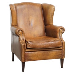 Sedia Wingback in pelle di pecora vintage
