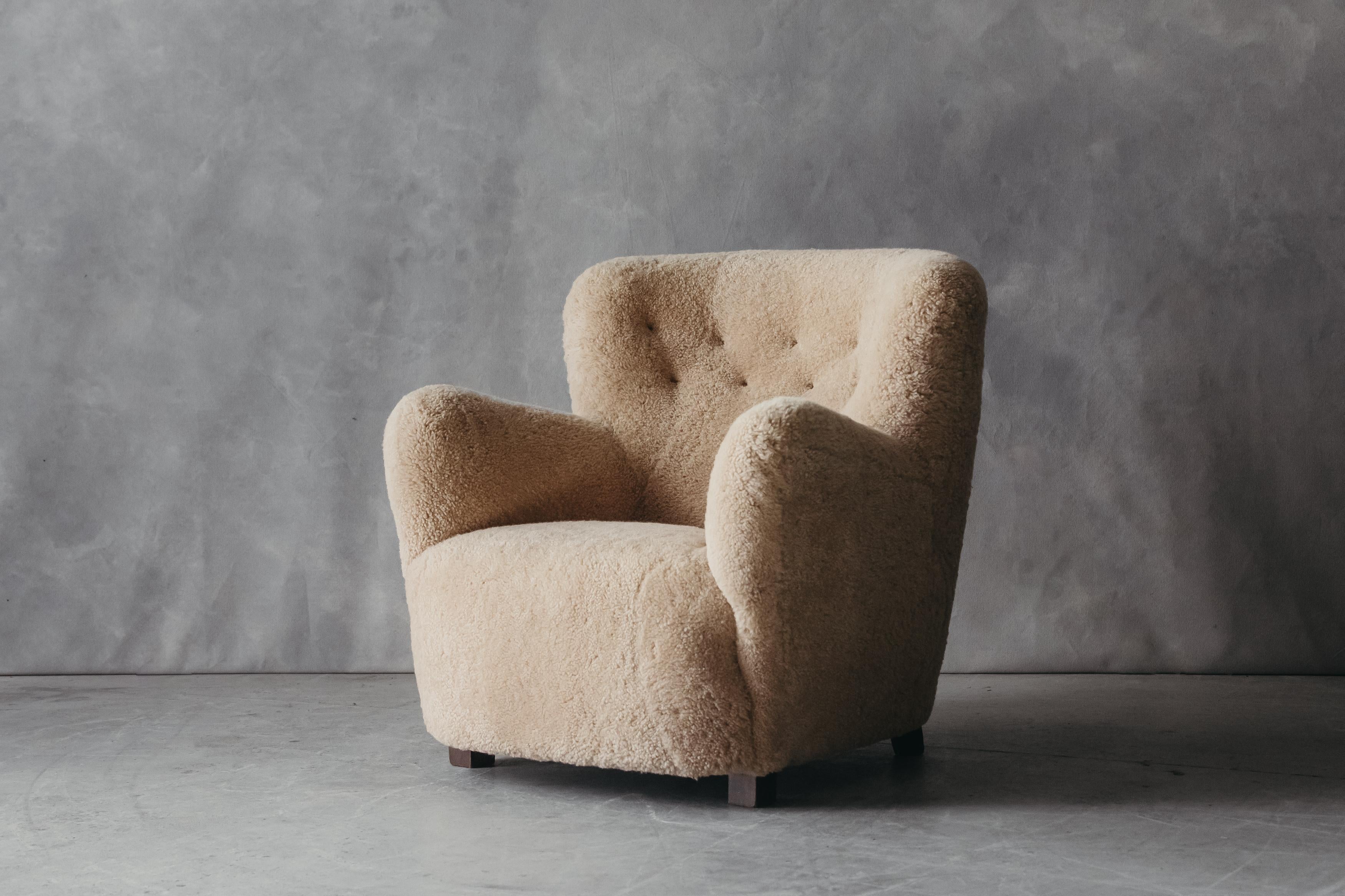 Vintage Sheepskin Lounge chair from Denmark, circa 1960. Very comfortable model, later upholstered in light tan shearling.

 