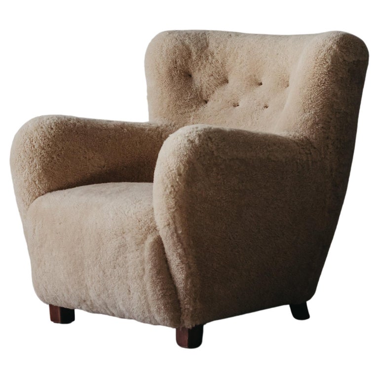 Danish sheepskin lounge chair, 1960s, offered by Eneby Home