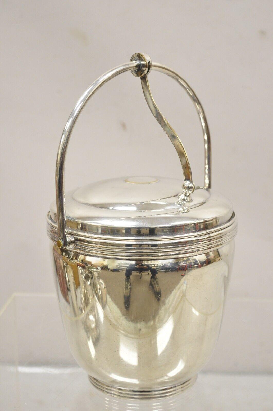 Vintage Sheffield Silver Co. Silver Plated Ice Bucket w/ Reticulated Hinge Lid and Ice Tongs. Circa Mid 20th Century.
Measurements:  13