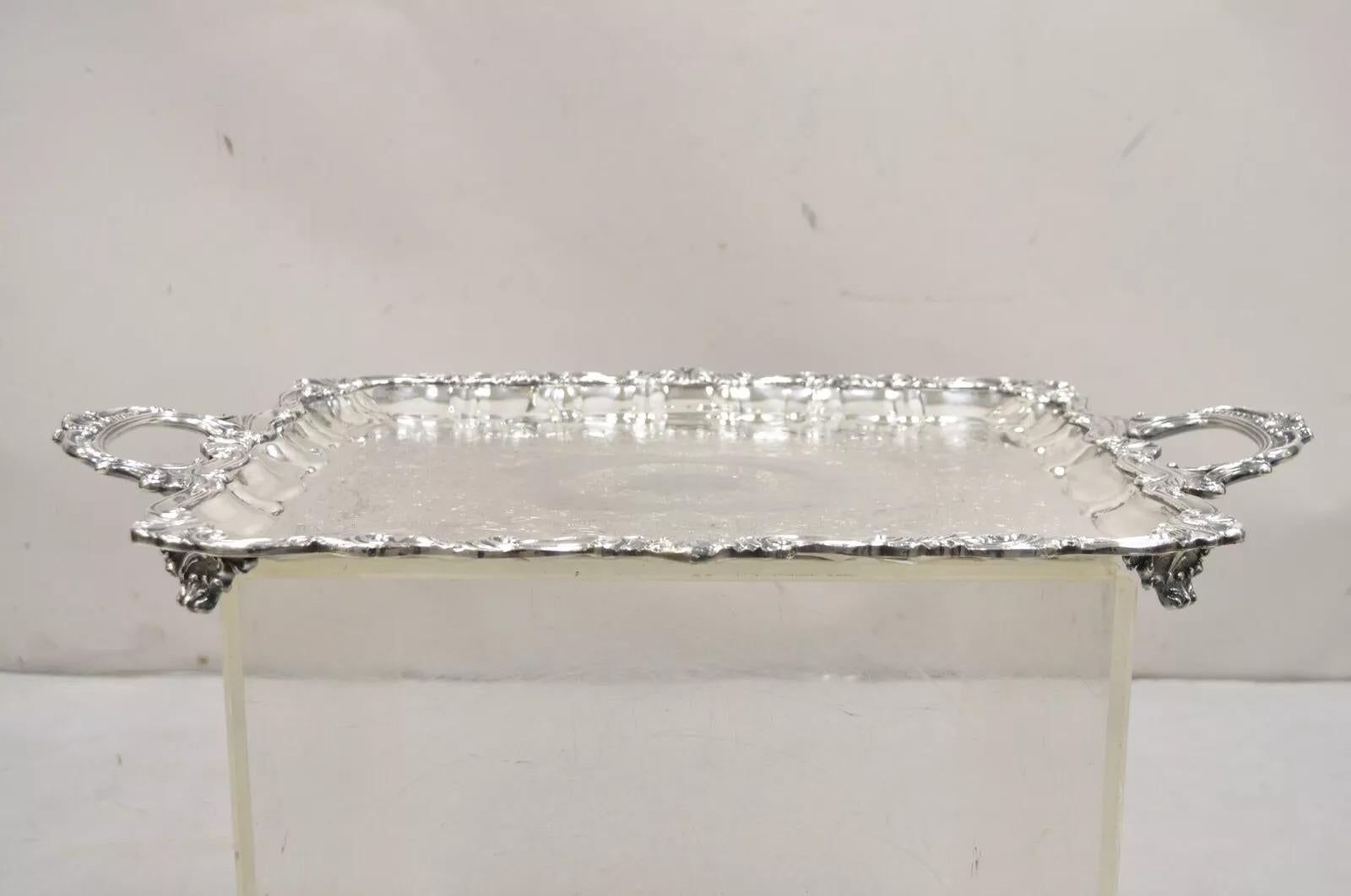 Vintage Sheffield Victorian Style Silver Plated Rectangular Serving Platter Tray. Item features scrollwork etched center, raise don ornate feet, very nice vintage tray. Circa Mid 20th Century. Measurements: 2