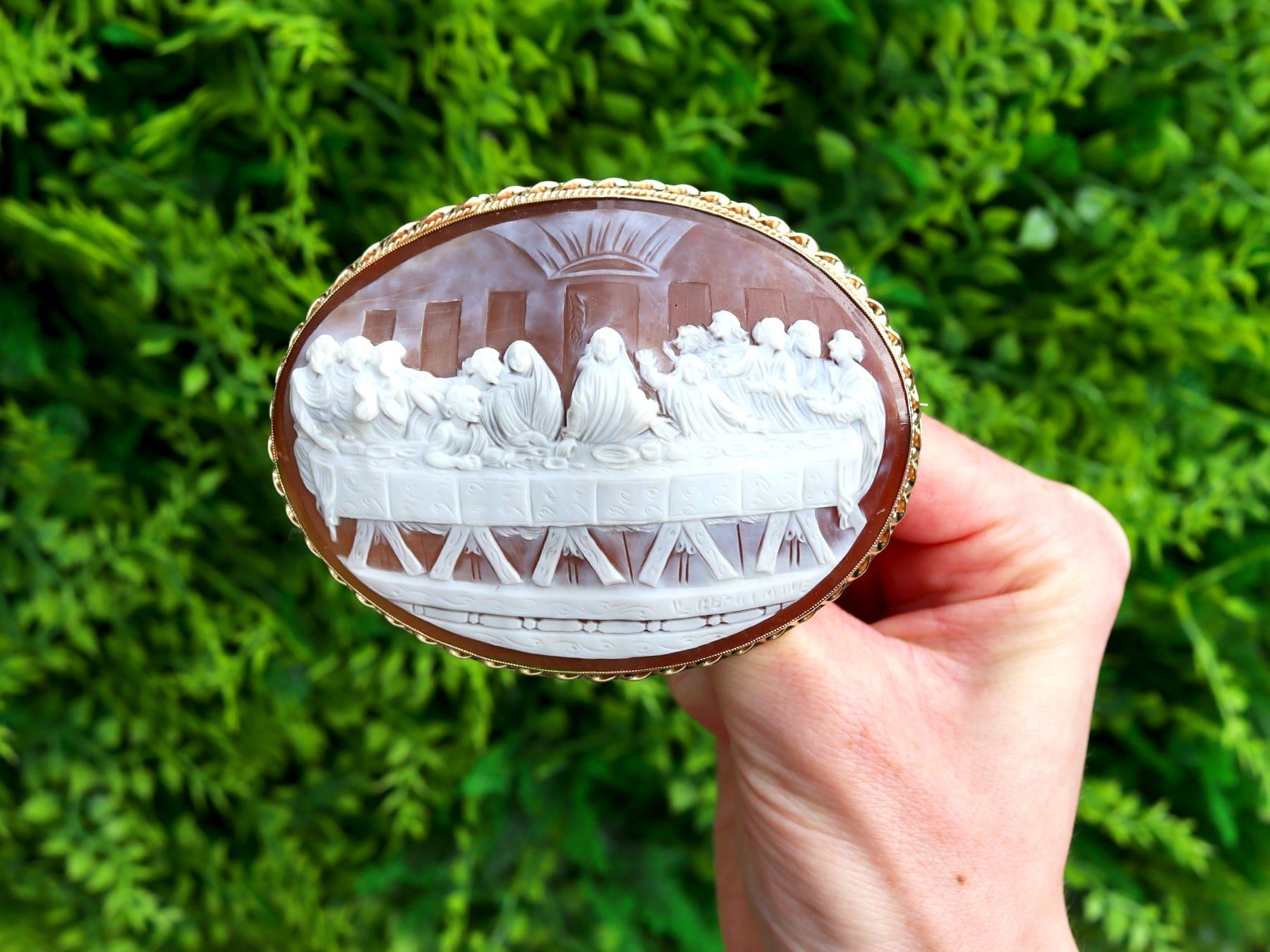 An exceptional, fine and impressive, large vintage shell and 9 karat yellow gold cameo brooch depicting the Last Supper; part of our cameo jewelry collections.

This exceptional and large vintage brooch has been crafted in 9k yellow gold.

The oval