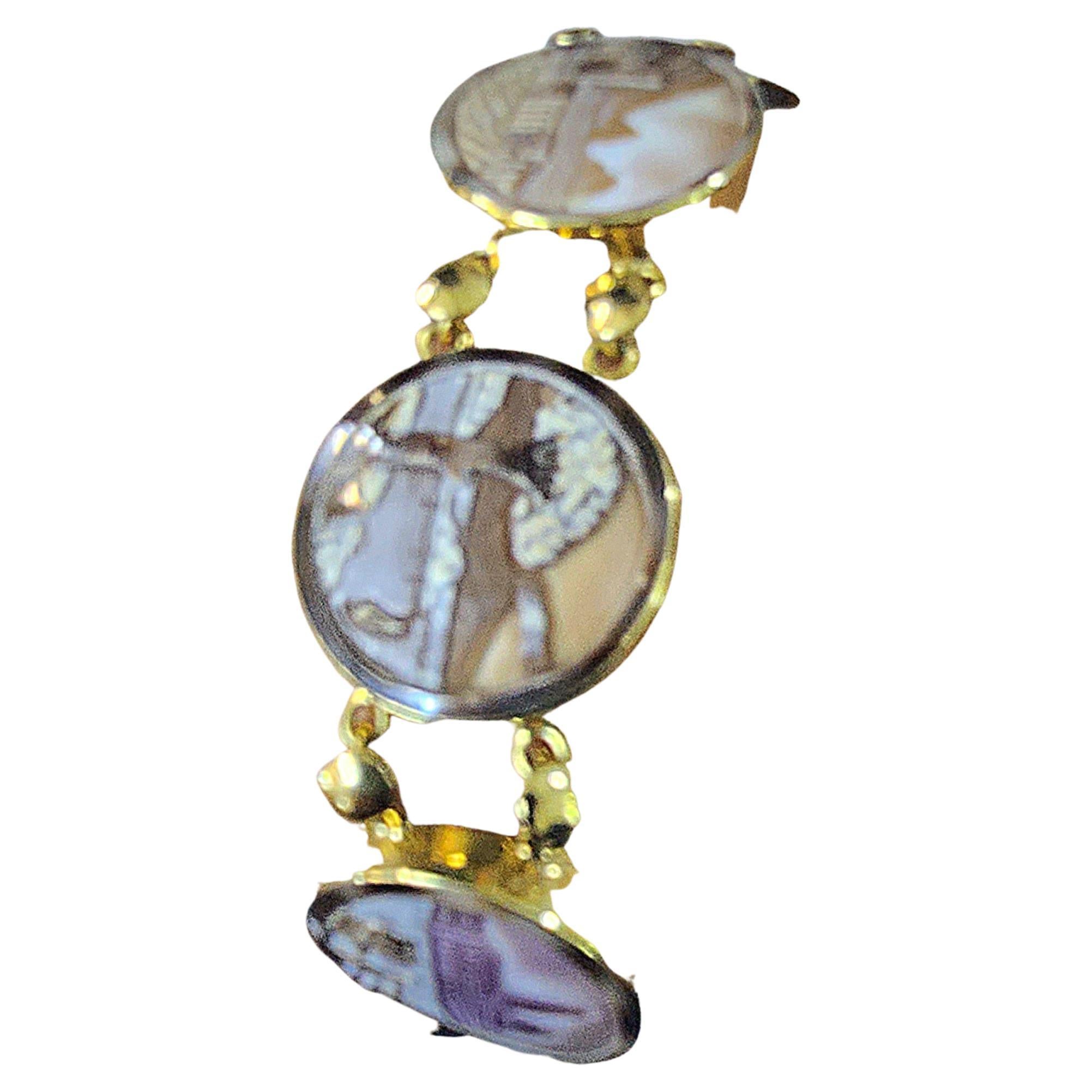 Vintage 18k gold bracelet in engraved natural shell cameo rome hestorical sights in 18k gold settings 28.4 grams 18.5 cm lenght and cameo diameter 2.1 cm width bracelet was made in italy between 1950s 