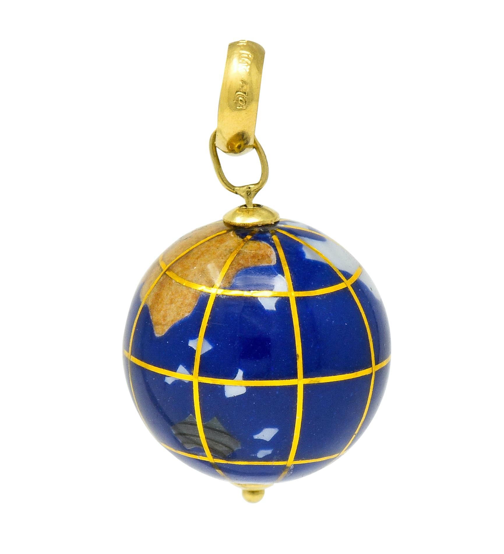 Pendant is designed as a round globe with bright blue color accented by metallic latitude and longitude grid lines

Countries are represented as inlaid mother-of-pearl, abalone, unakite, and others; glossed with resinous finish

Spins on axis with