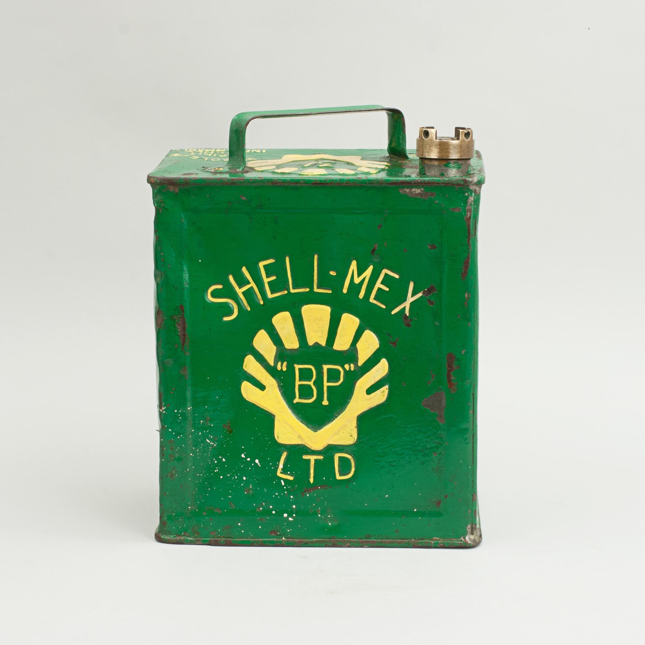 An original 2 gallon shell mex petrol can complete with original brass screw cap. The gasoline can has three embossed shell logos, one on the top with 3/- inside the shell. The other two are on the front and back of the can with 'BP' in the middle.