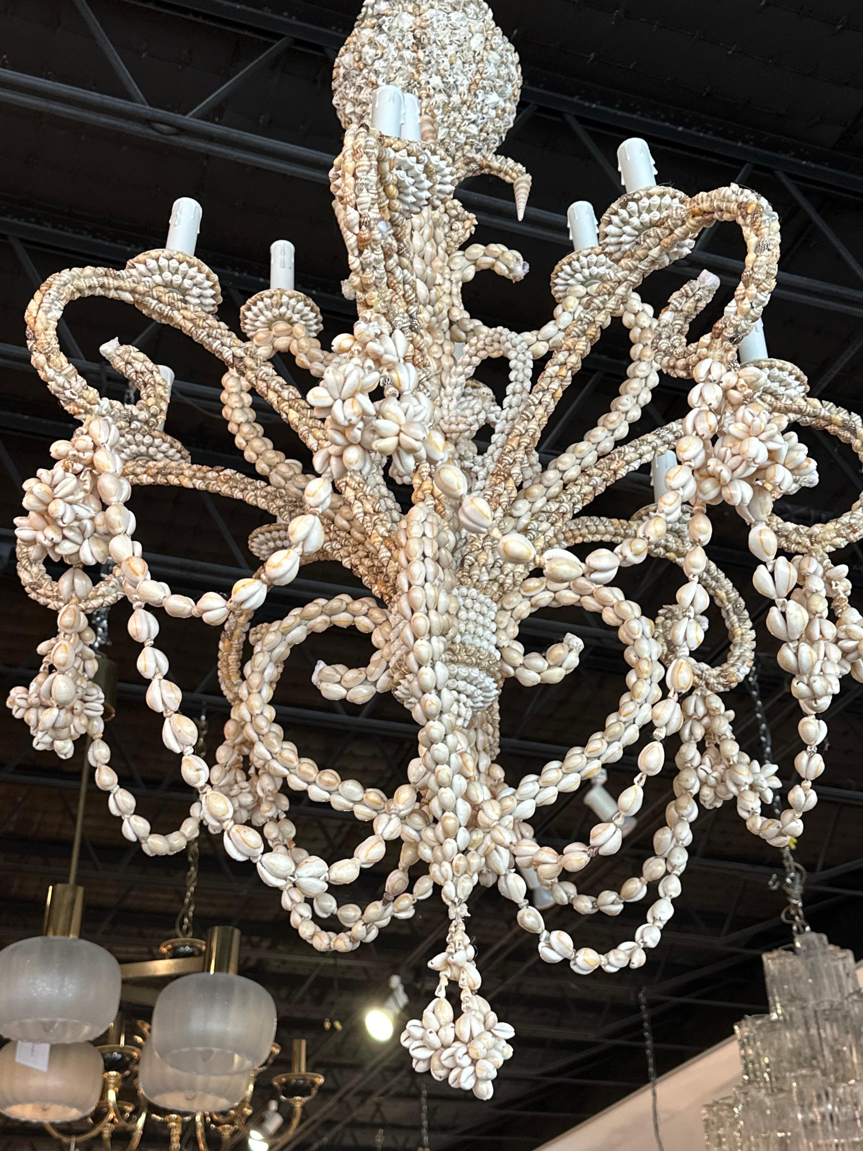 Vintage Palm Beach shell seashell encrusted 12 light chandelier. Tested working order. New candelabra sleeves. No damage or missing shells. Comes with original matching seashell ceiling cap. I have another matching chandelier if a pair is needed.