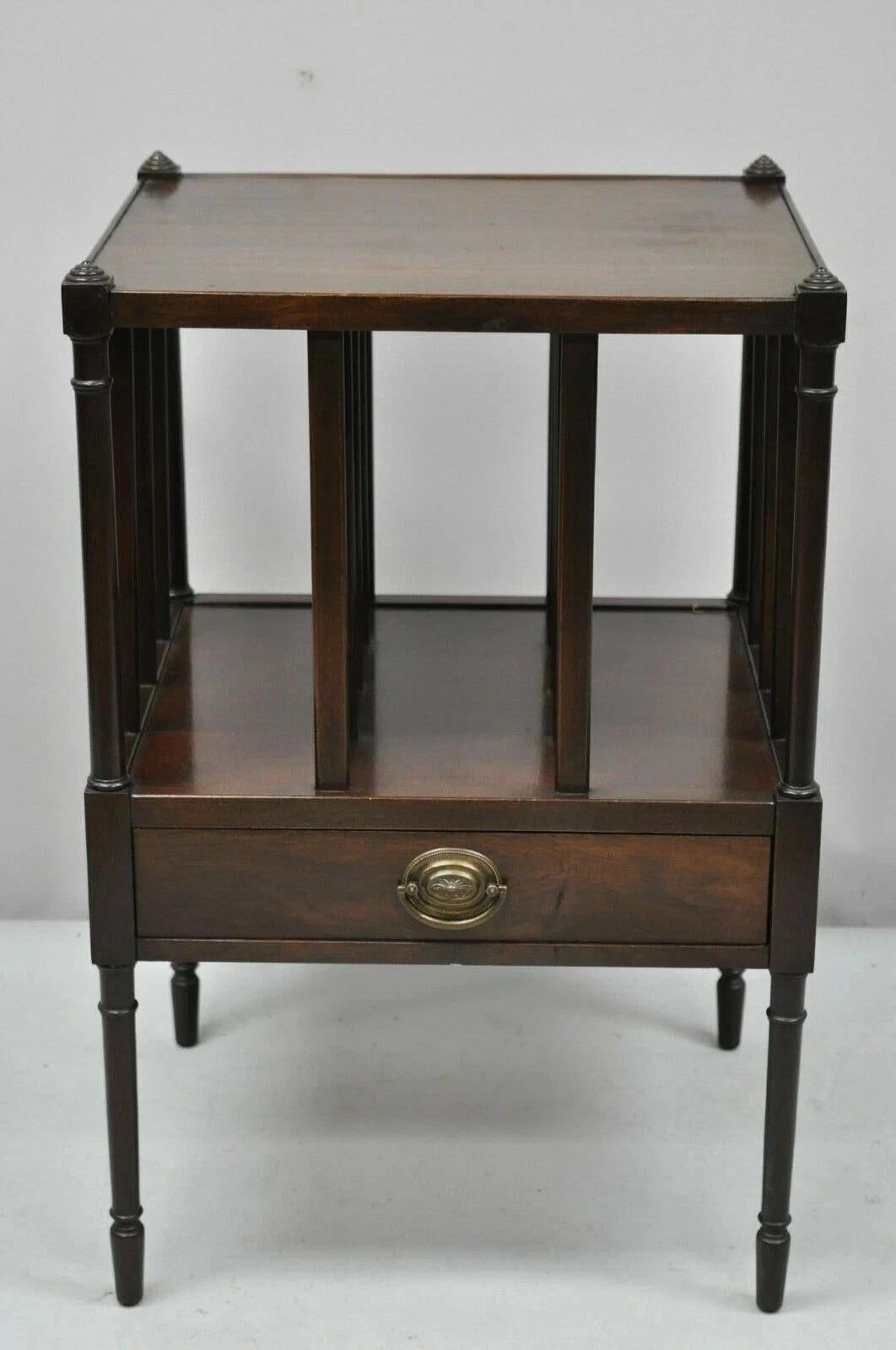 Vintage Sheraton Federal Style Mahogany Magazine Rack Book Stand Side End Table. Item features solid brass hardware and one drawer. Circa Early 20th Century. Measurements: 27