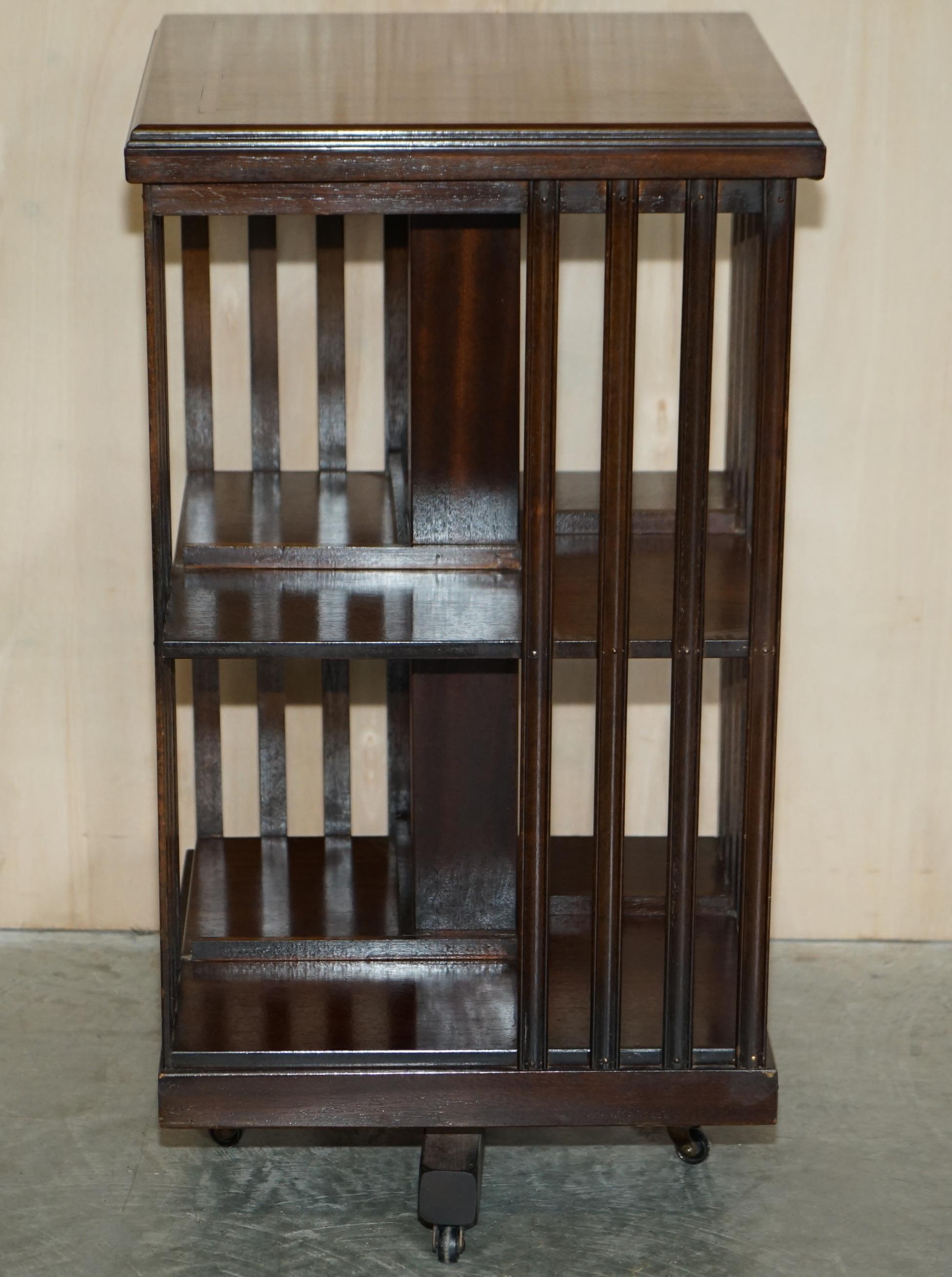 We are delighted to offer for sale this stunning vintage Sheraton Revival Mahogany & Satinwood revolving bookcase table

A very good looking well made and decorative piece. Made in the Sheraton revival style with wonderful inlay and extremely