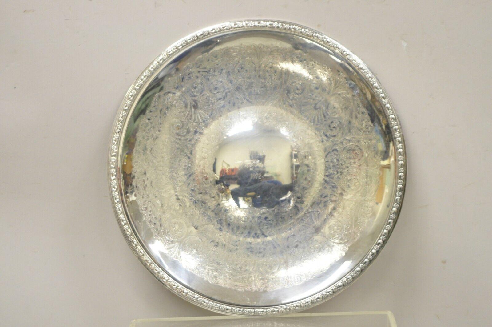 Vintage Sheridan 18” Round Award Platter Tray. Item features floral etching throughout, Original Hallmark, Center Engraved, “Winner Tropical at Calder 1972”. Circa Late 20th Century. Measurements:  1
